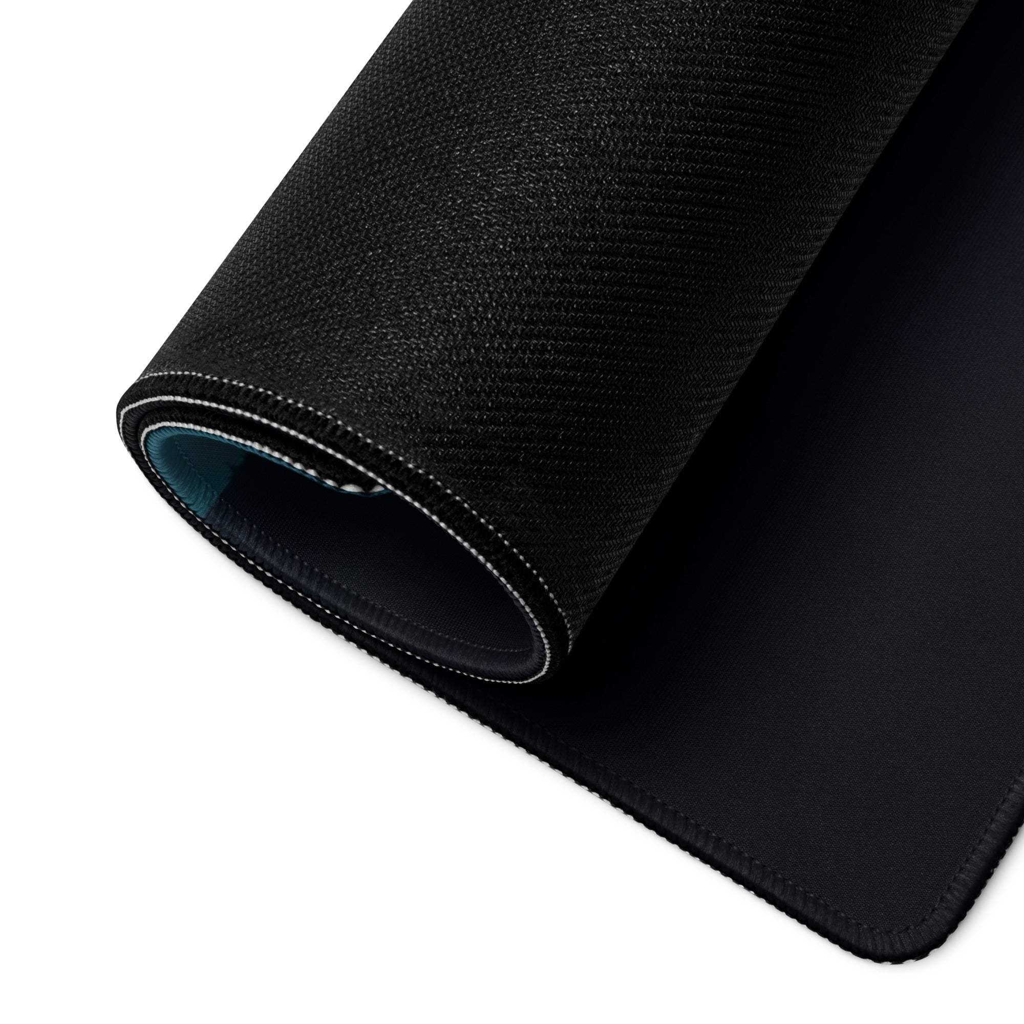 Black textured gaming mousepad with stitched edges, teal lining, non-slip base