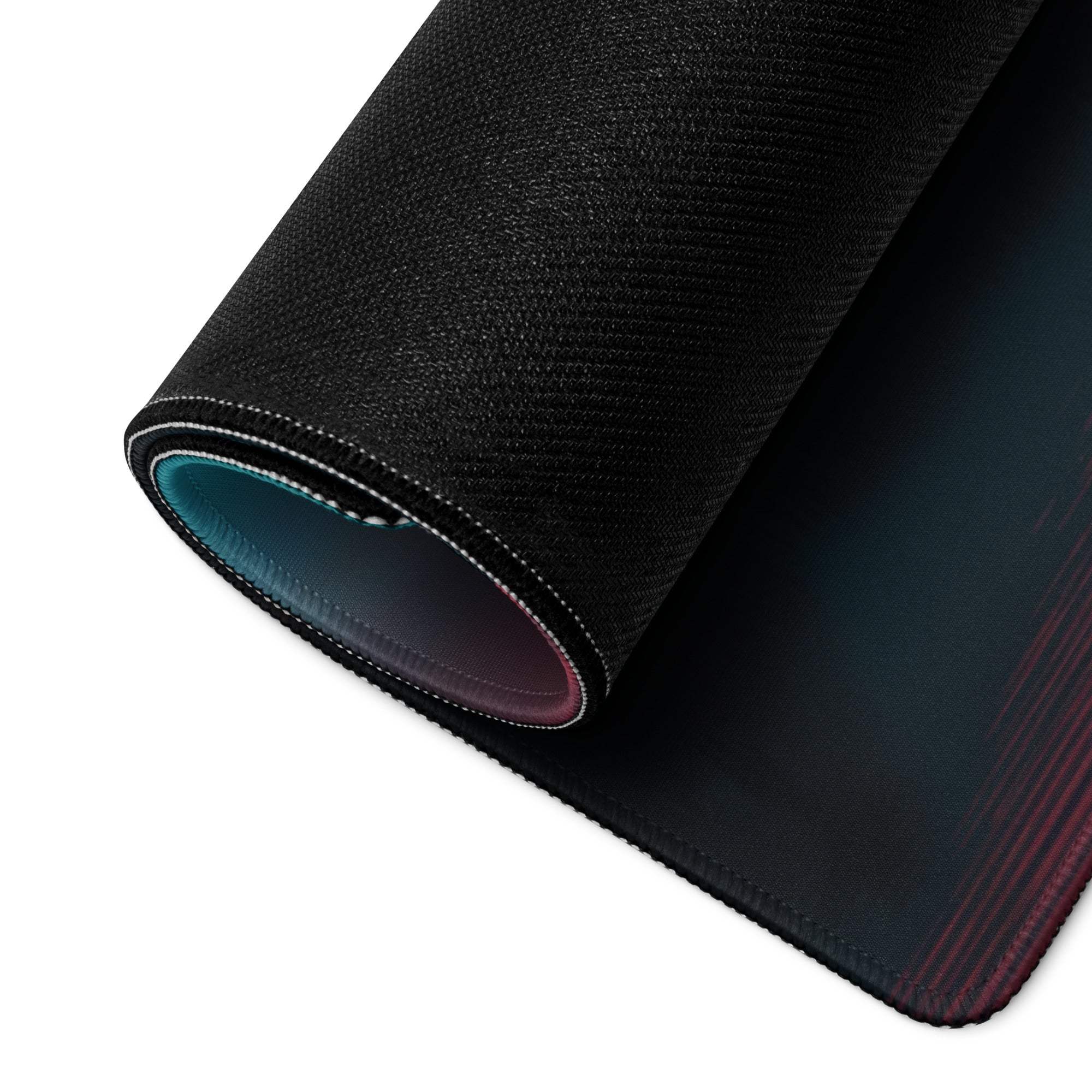 Black textured gaming mousepad with teal-purple gradient edge and non-slip backing