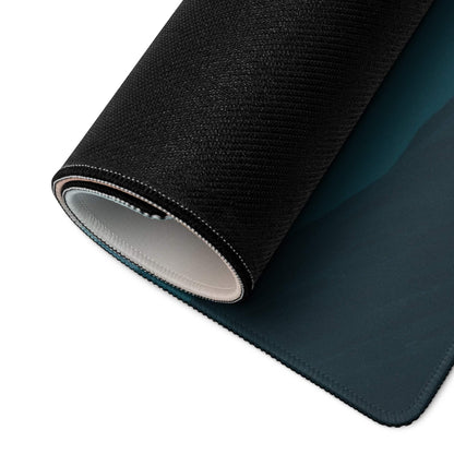 Black textured gaming mousepad with teal gradient, white stitching, non-slip base