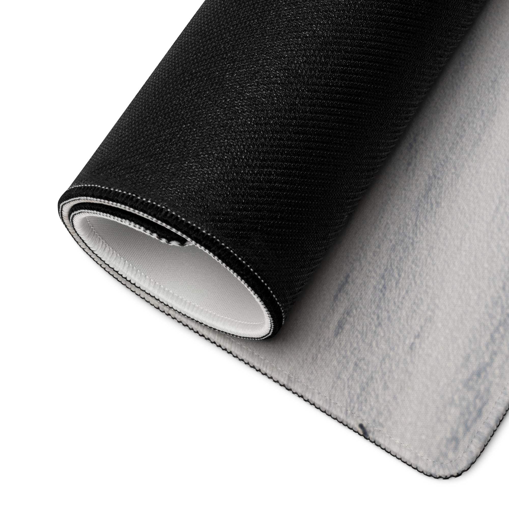 Back of Calm Winter Blue Snowfield large gaming mouse pad with black textured carpet, white felt backing and stitched edges