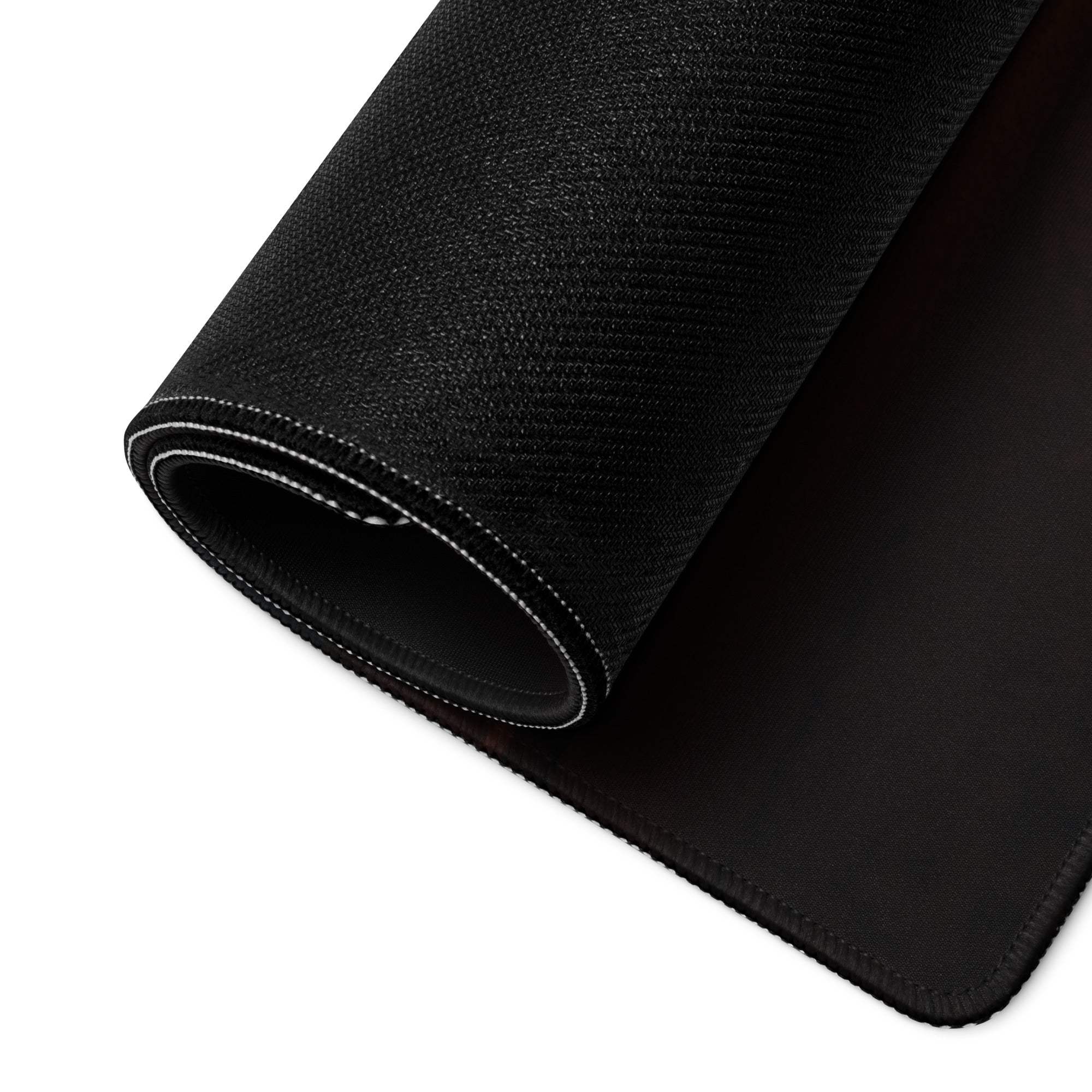Black textured gaming mousepad with white edge stitching and non-slip base