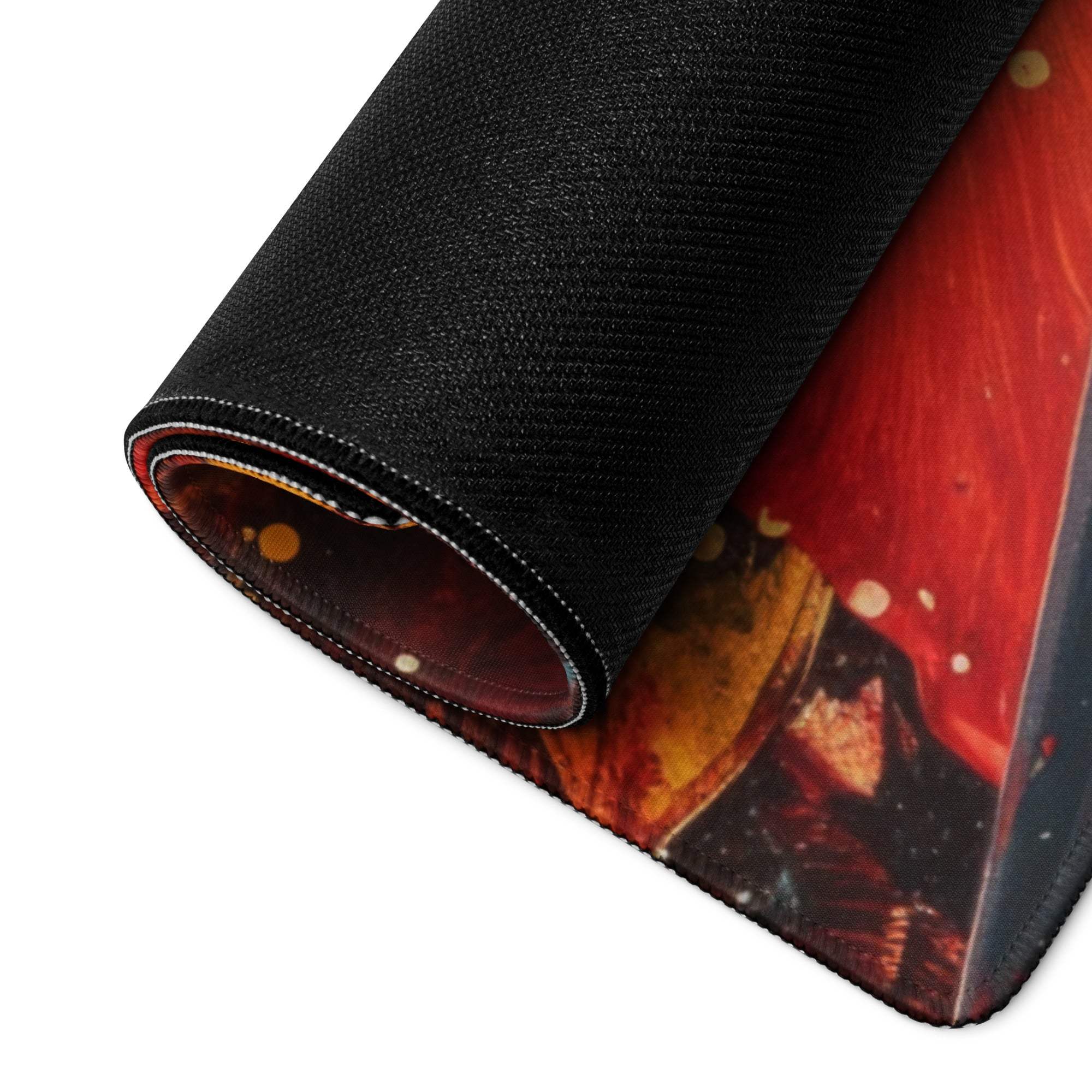 Black gaming mousepad with vibrant fiery red orange design and non-slip base