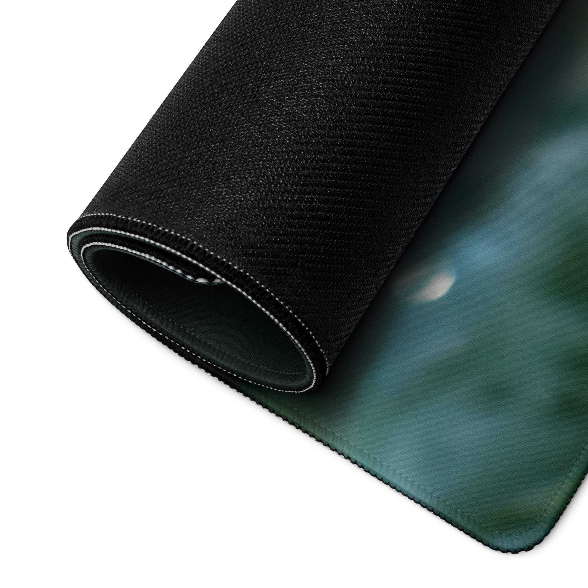 Black textured gaming mousepad with subtle green gradient surface