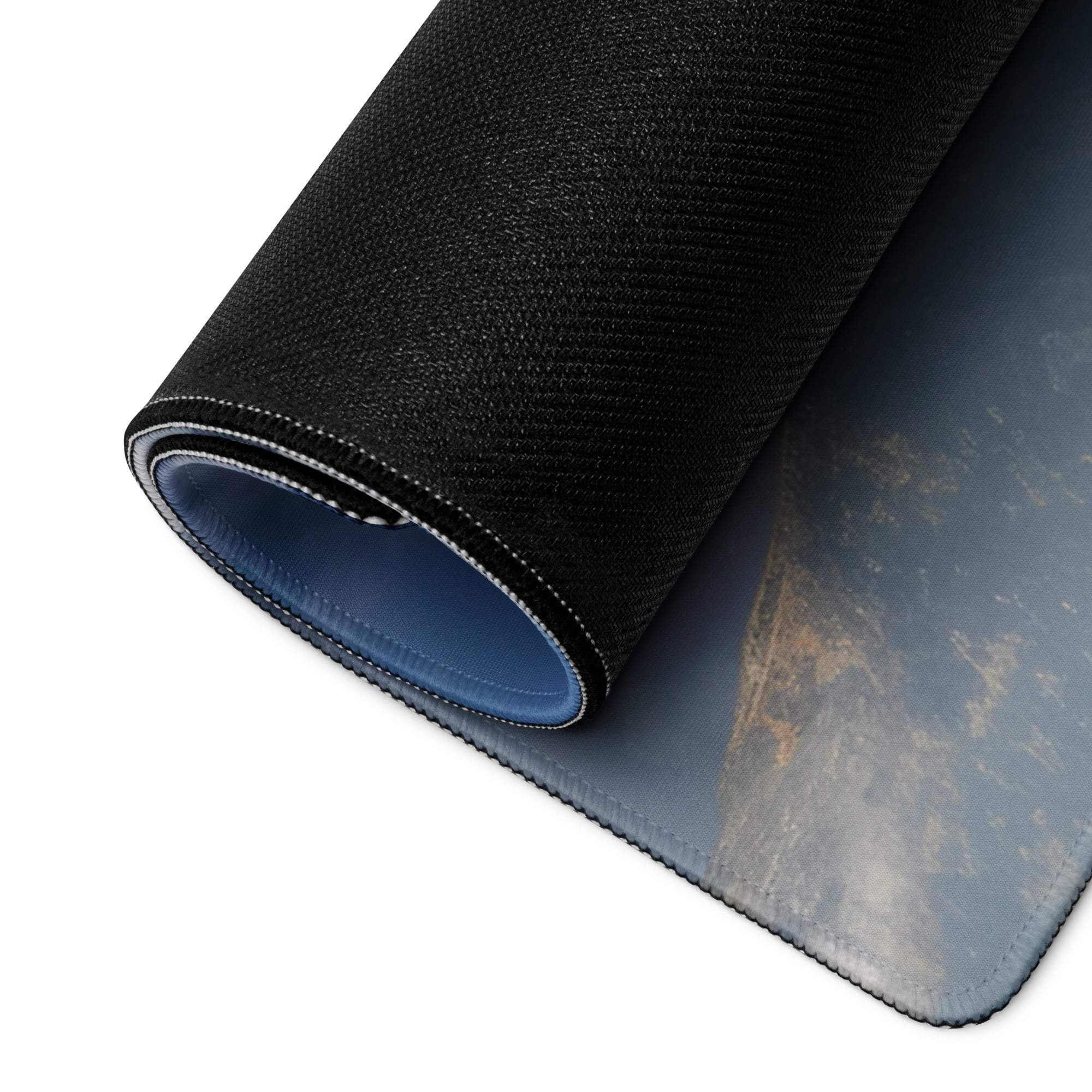 Black textured gaming mousepad with blue non-slip base, stitched edges