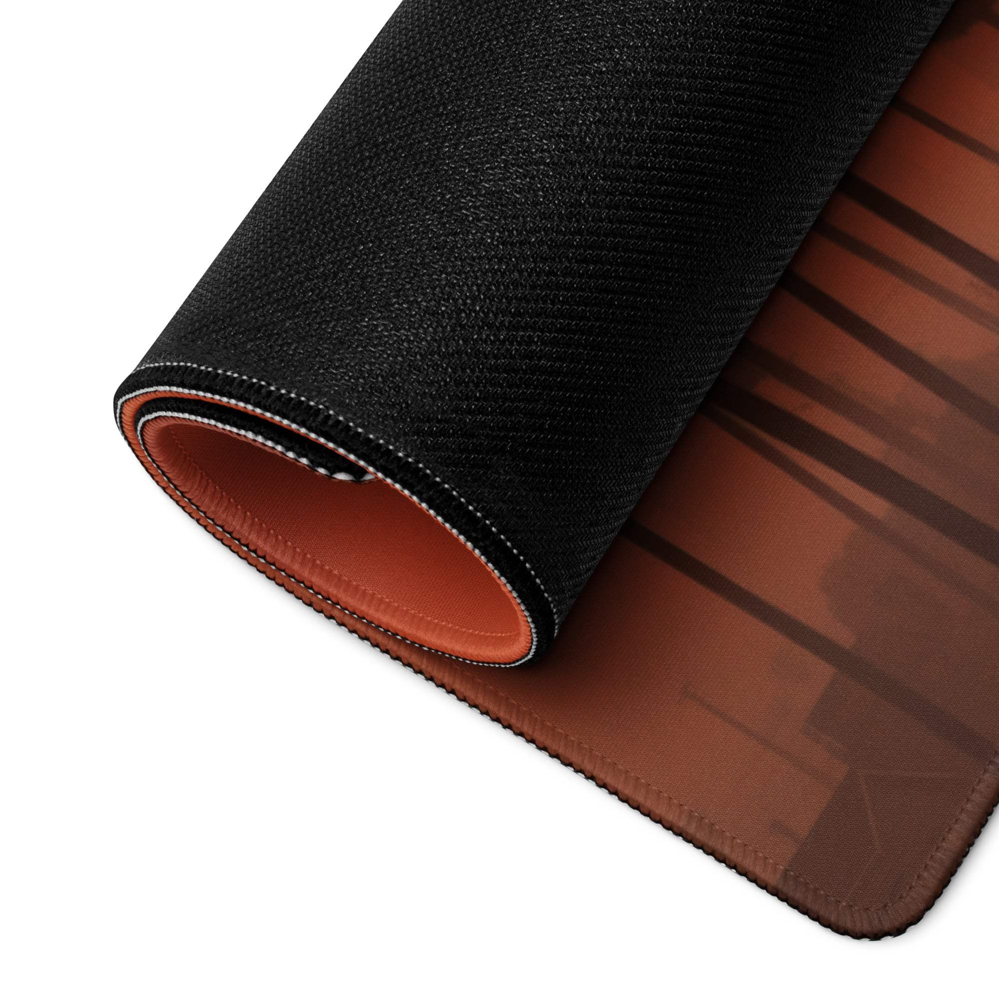 Black and brown textured gaming mousepad with orange inner lining and palm sunset scene