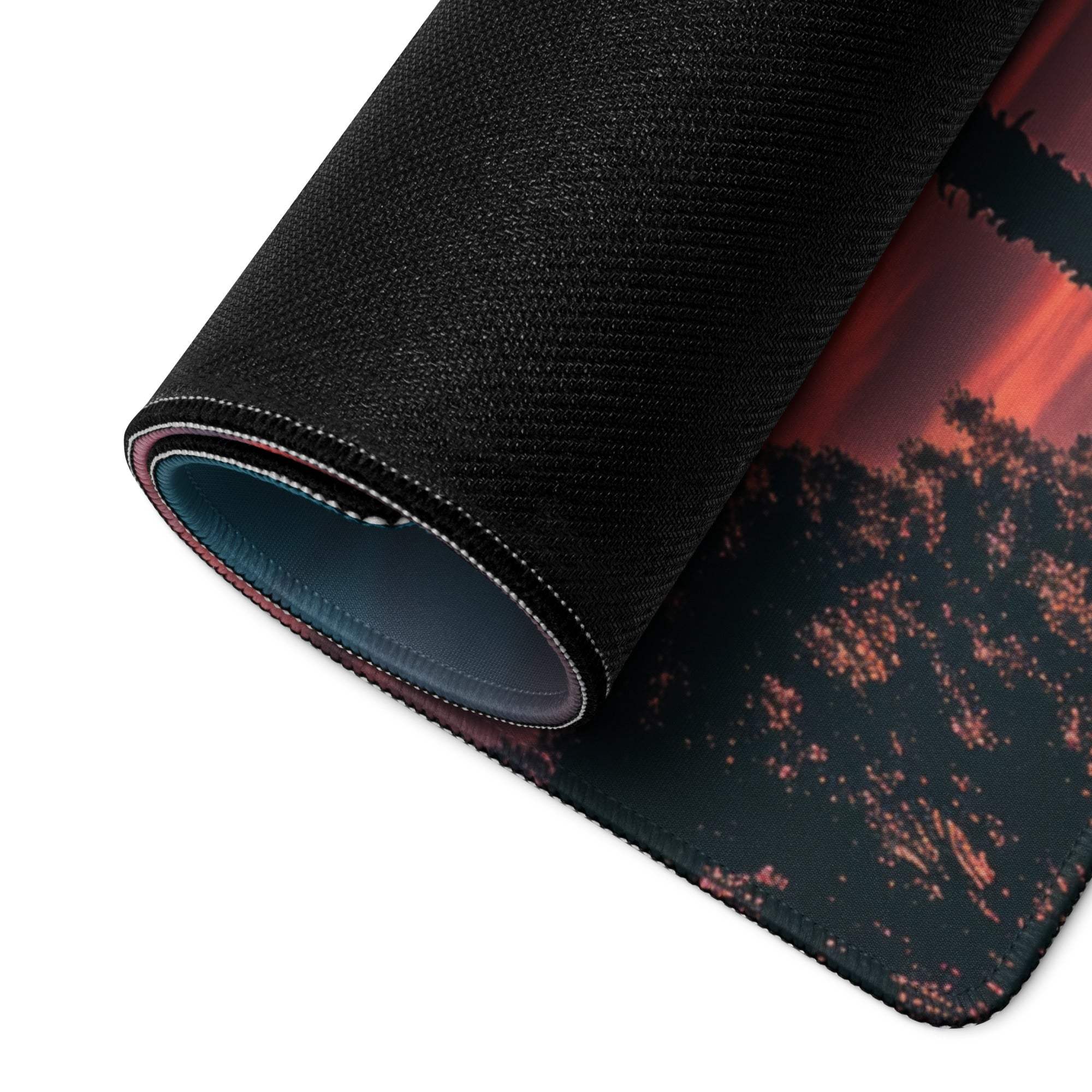 Large palm tree sunset gaming mousepad rolled to show non-slip back and stitched edge