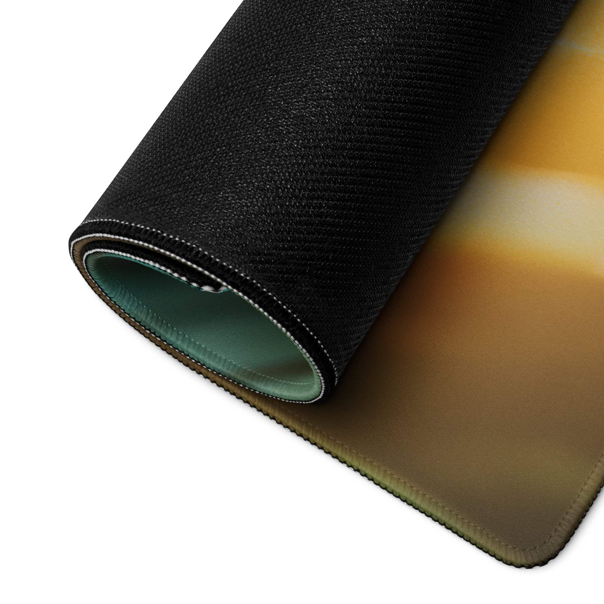 Black textured gaming mousepad with orange-yellow gradient, green lining, non-slip base
