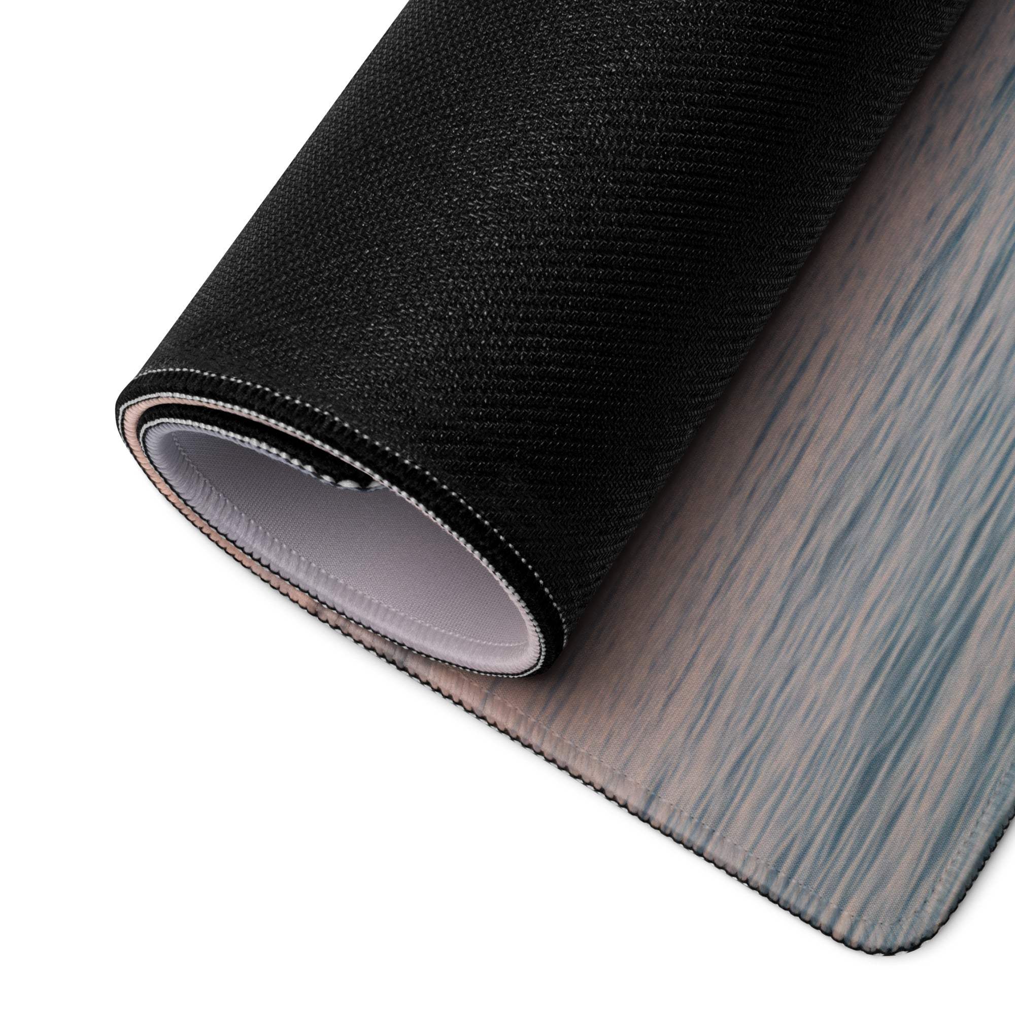 Black textured mousepad with gray wood-grain surface and non-slip base