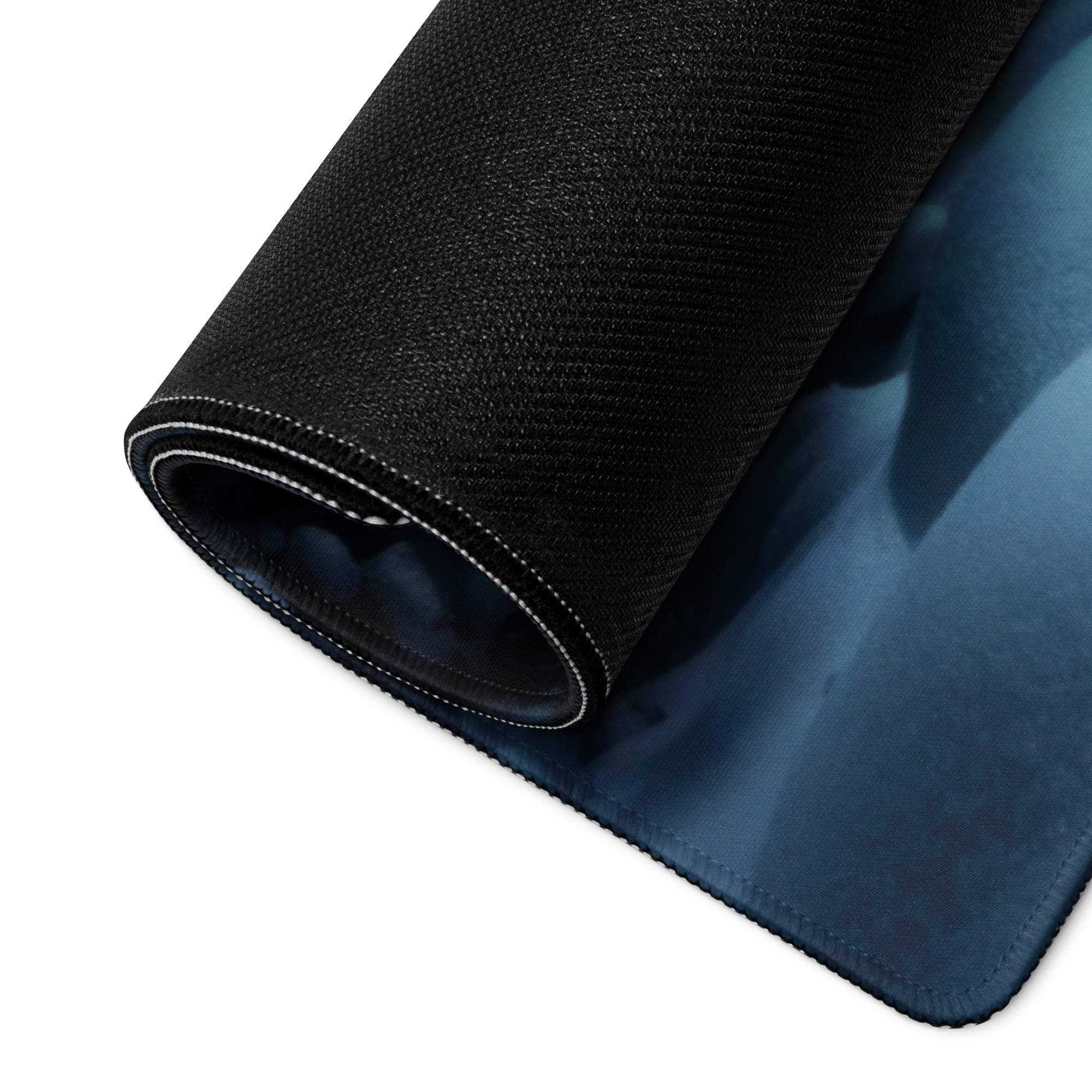 Black textured gaming mousepad with blue gradient, white stitching, non-slip base