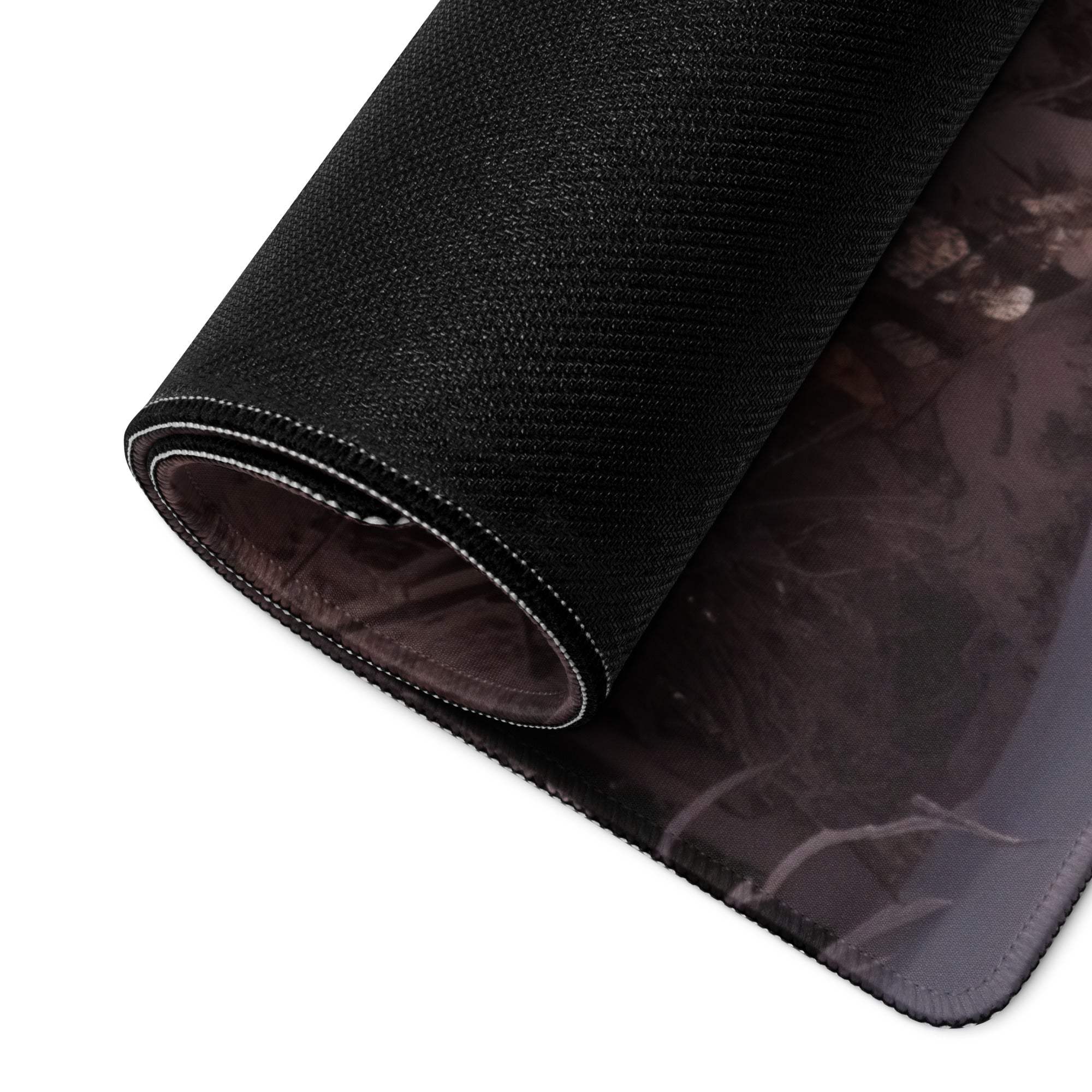 Epic snowy forest sunset gaming mouse pad with black texture and white stitching
