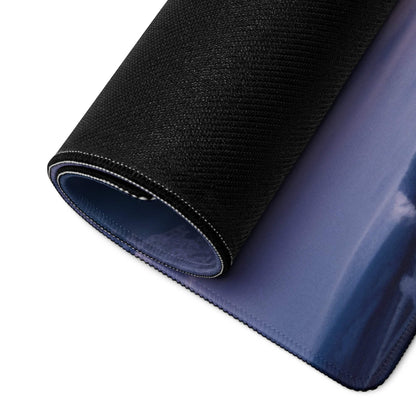 Back of Tranquil Winter Forest gaming mouse pad with black textured outer layer and glossy navy blue inner surface
