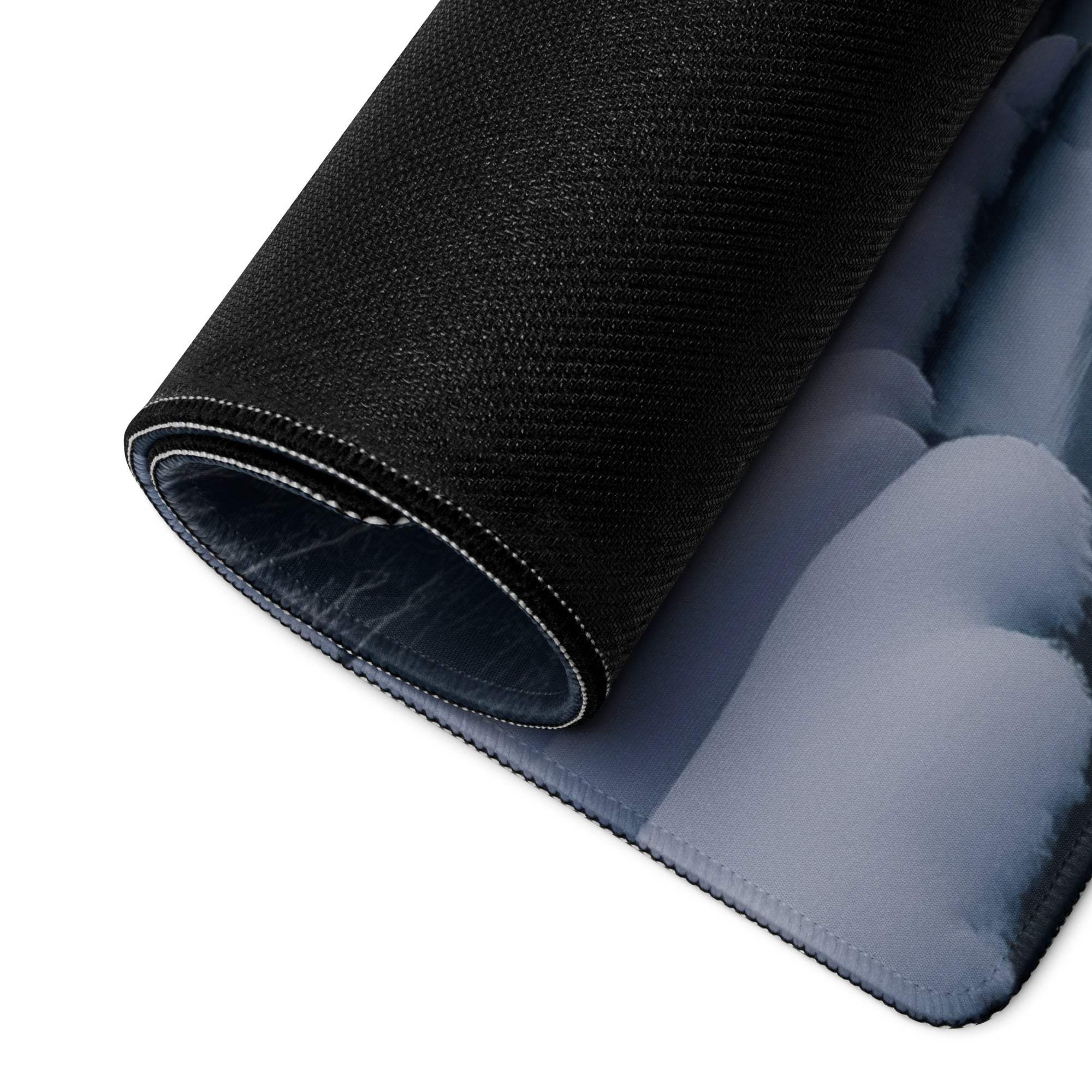 Backside of Serene Winter Mountain gaming mouse pad with black textured non-slip blue gradient underside