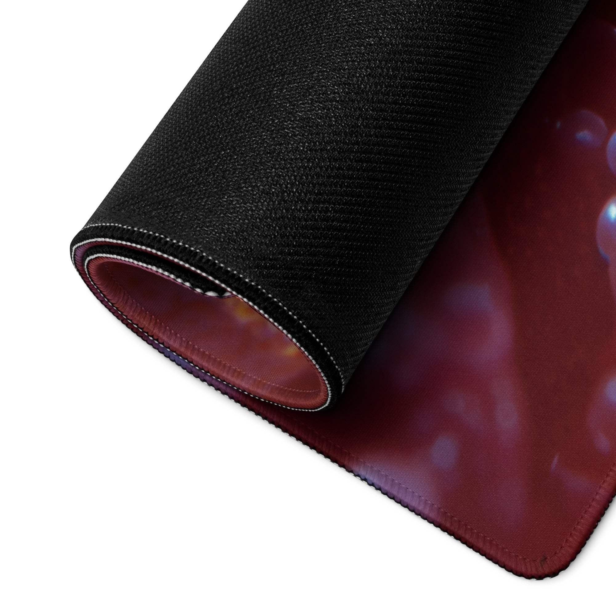 Black textured Neon Nebula gaming mousepad with maroon underside and glowing orb