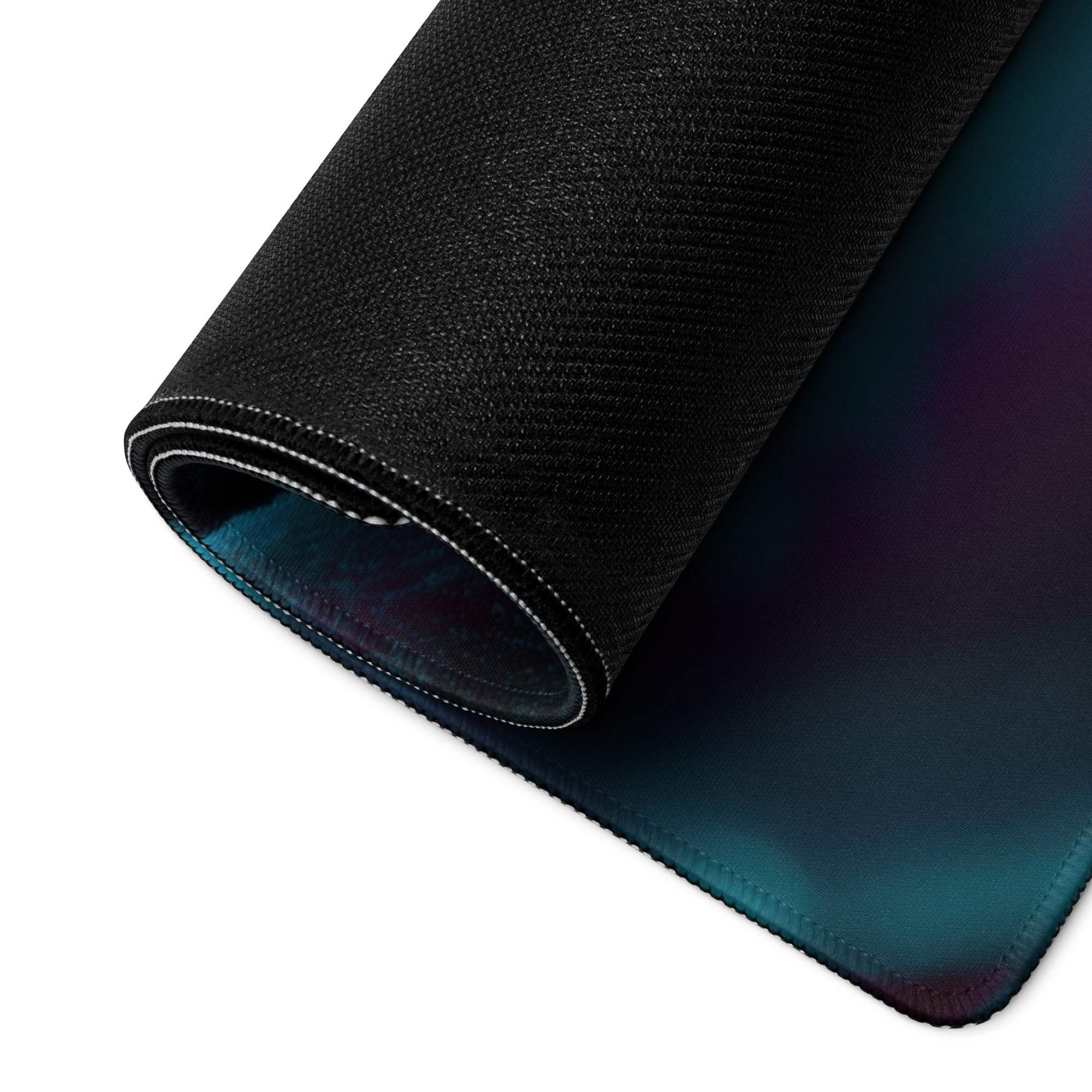 Black textured iridescent gaming mouse pad in teal to purple gradient
