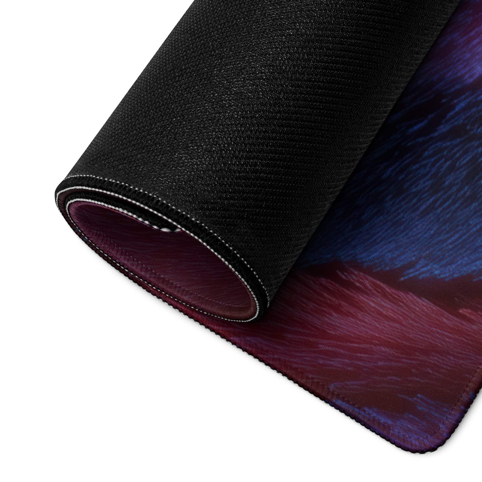 Rolled-up Bold Abstract Lava Blue Red gaming mouse pad with purple-to-blue gradient