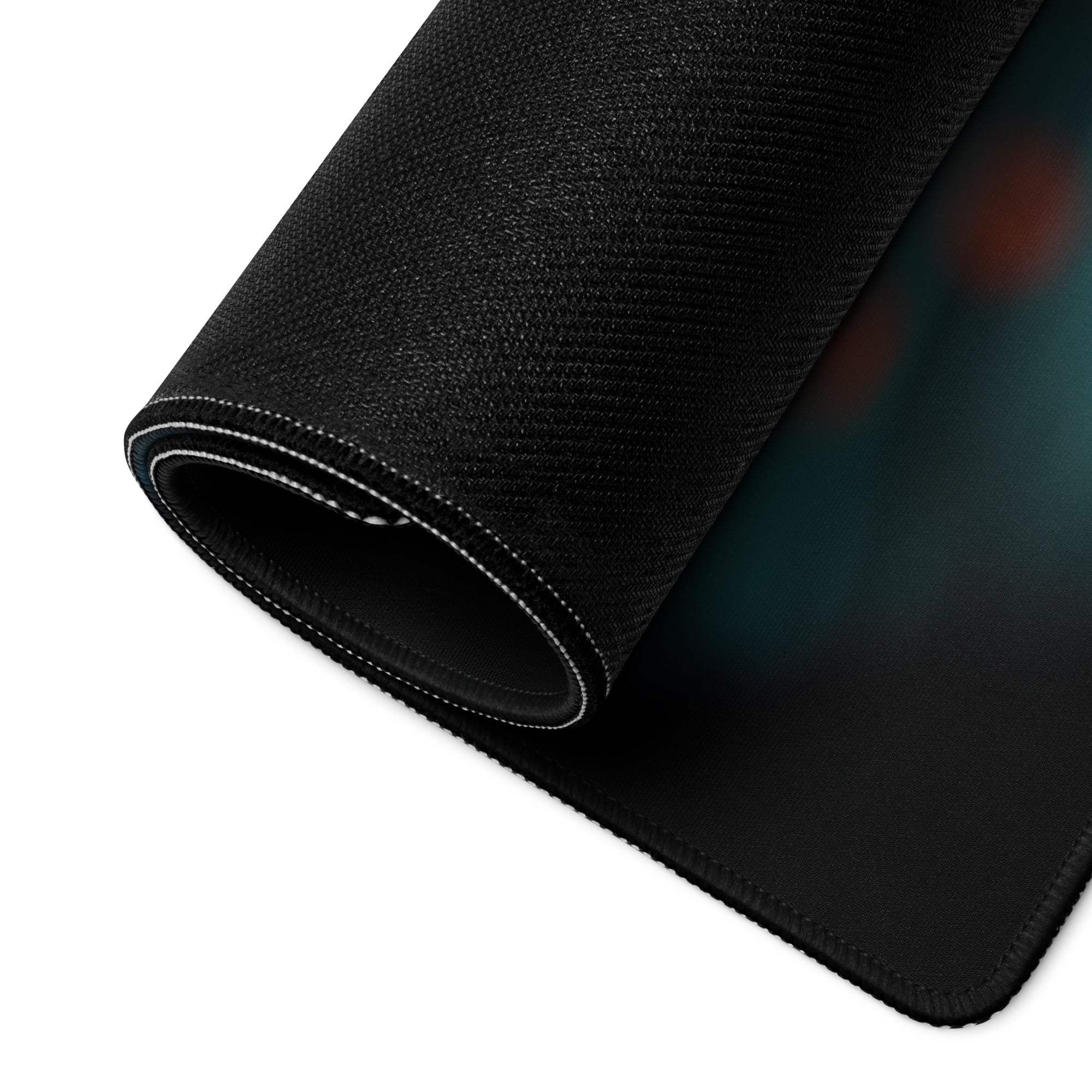 Large black textured gaming mousepad with teal orange glow gradient edge