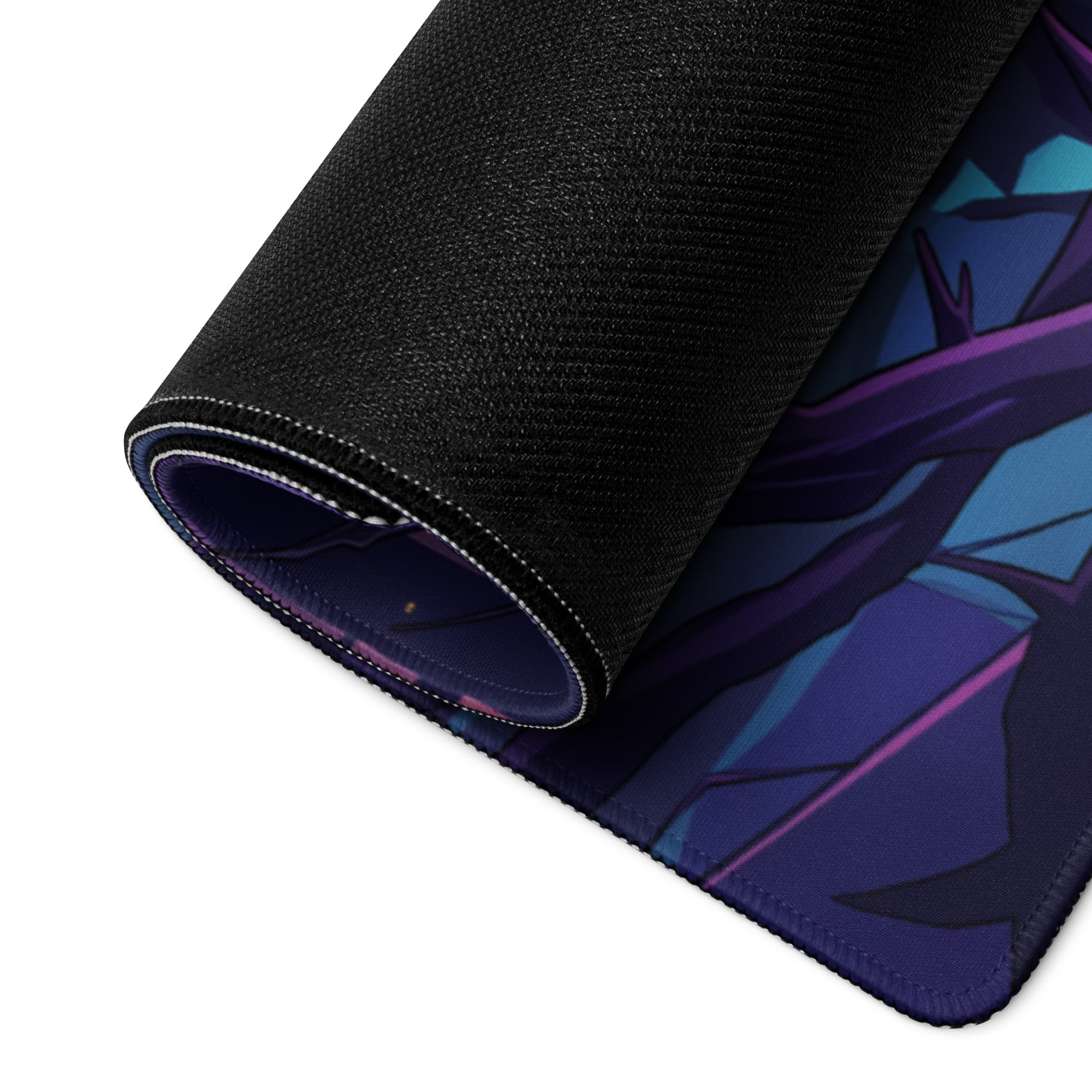 Rolled-up black gaming mousepad with vibrant purple and blue anime vaporwave design and stitched edges for desktop use