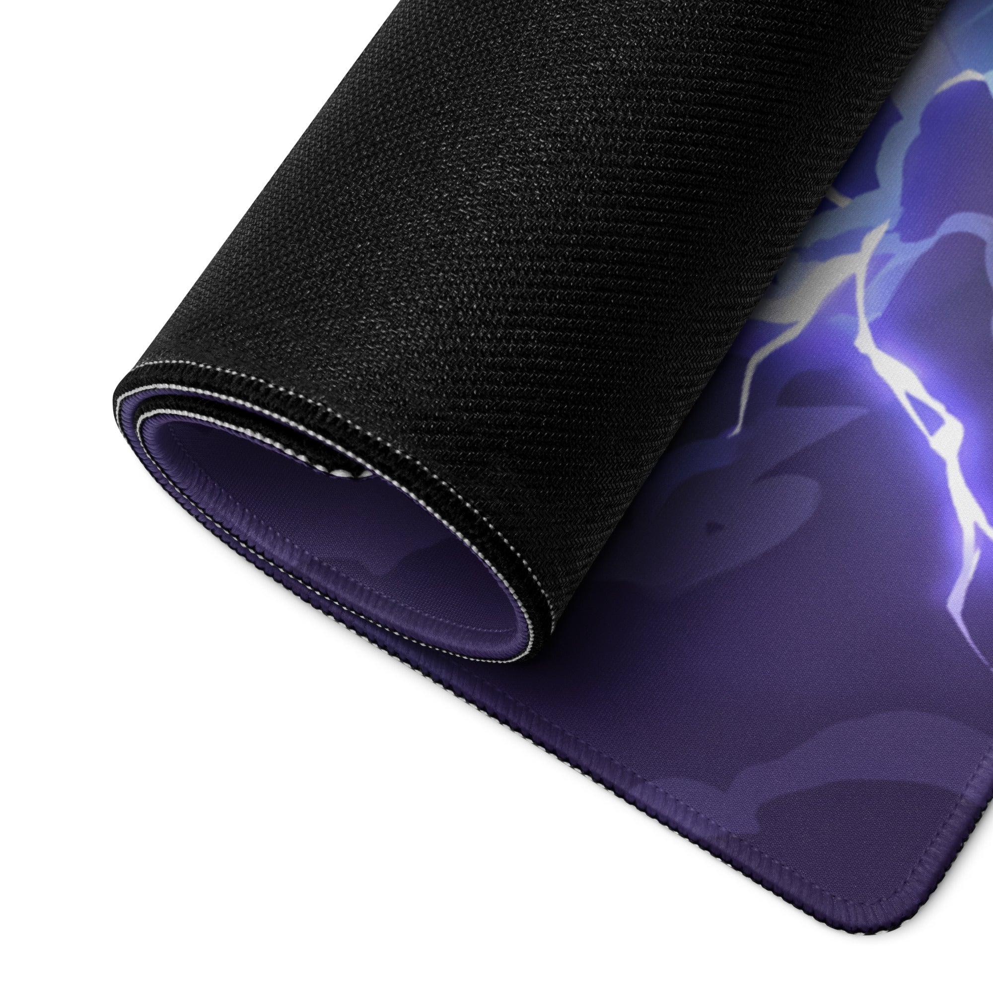 A rolled-up black gaming mousepad featuring a vibrant purple lightning design for vaporwave neon desk setups