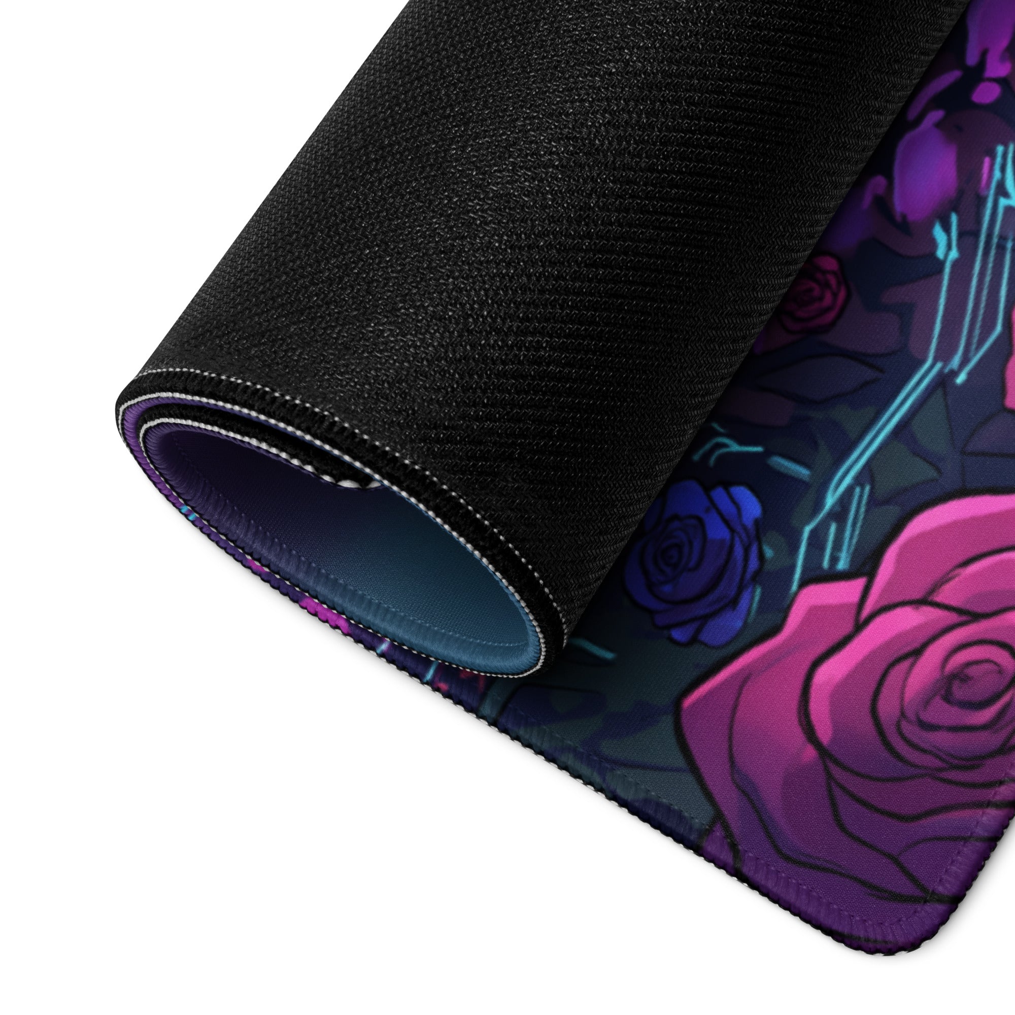 A rolled-up black gaming mousepad with vibrant pink and purple roses and glowing blue circuit lines neon vaporwave design