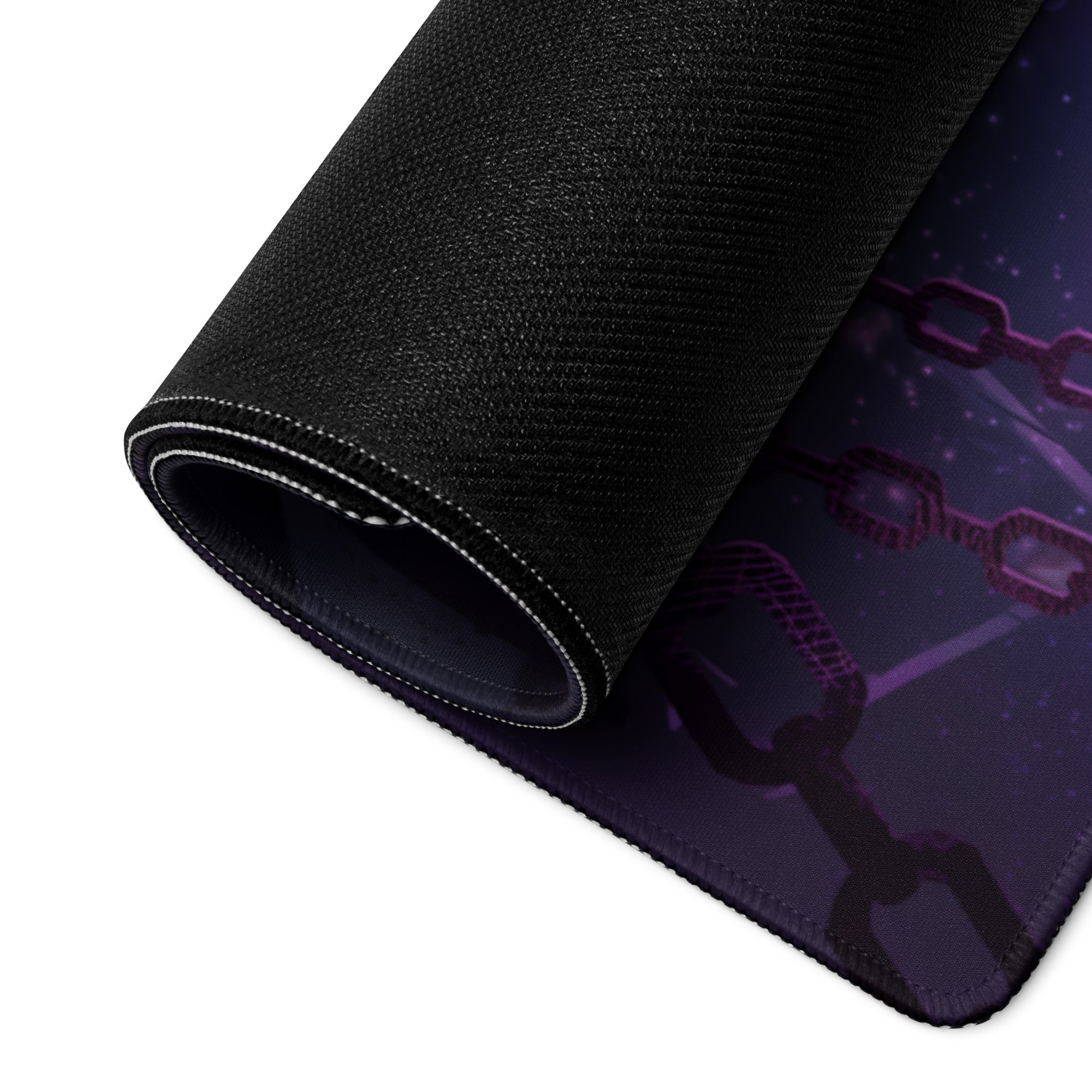A rolled-up black gaming mousepad with a purple chain design featuring vaporwave neon purple and blue digital art