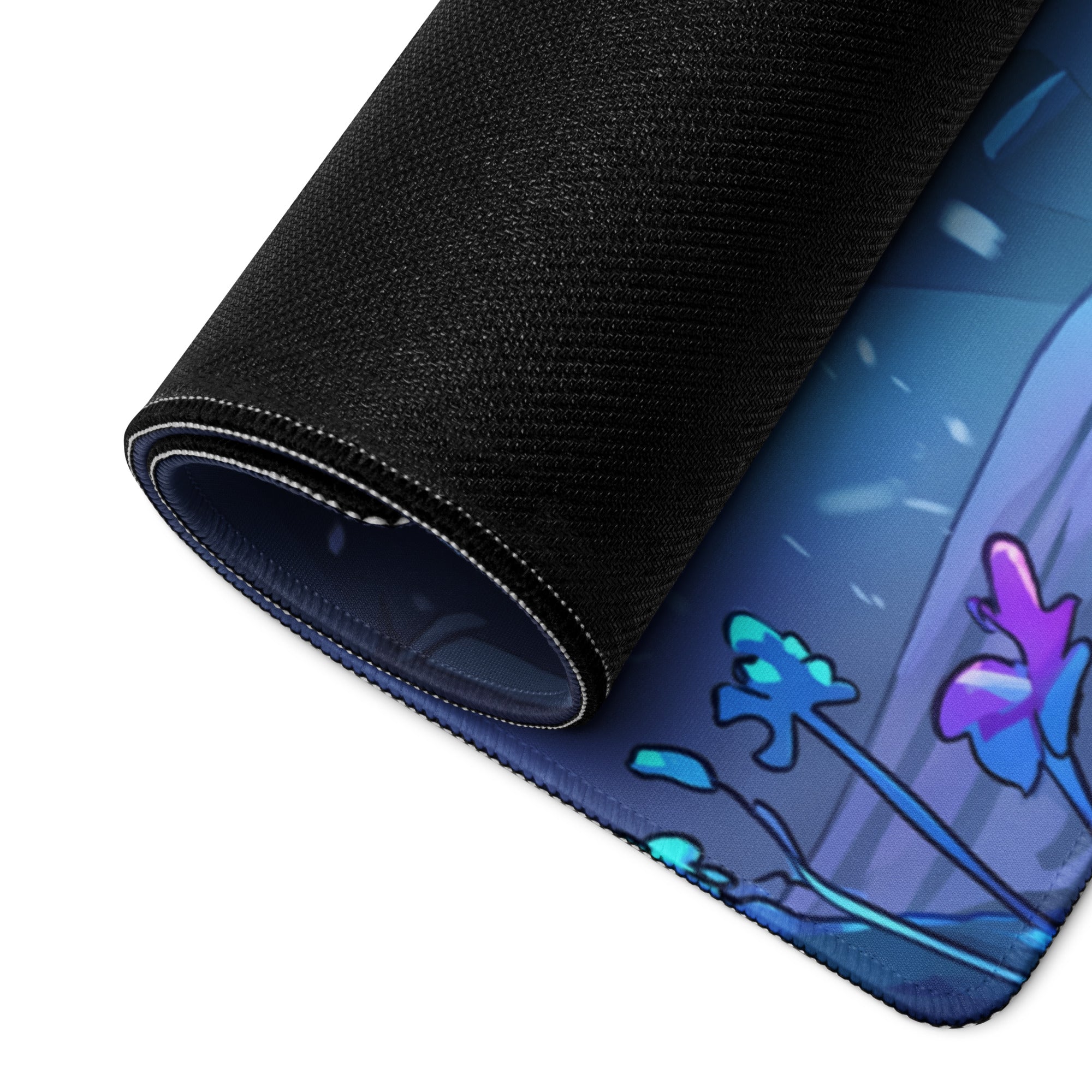 A rolled-up black neon night vaporwave arena mouse pad with vibrant blue and purple floral design for gaming desks