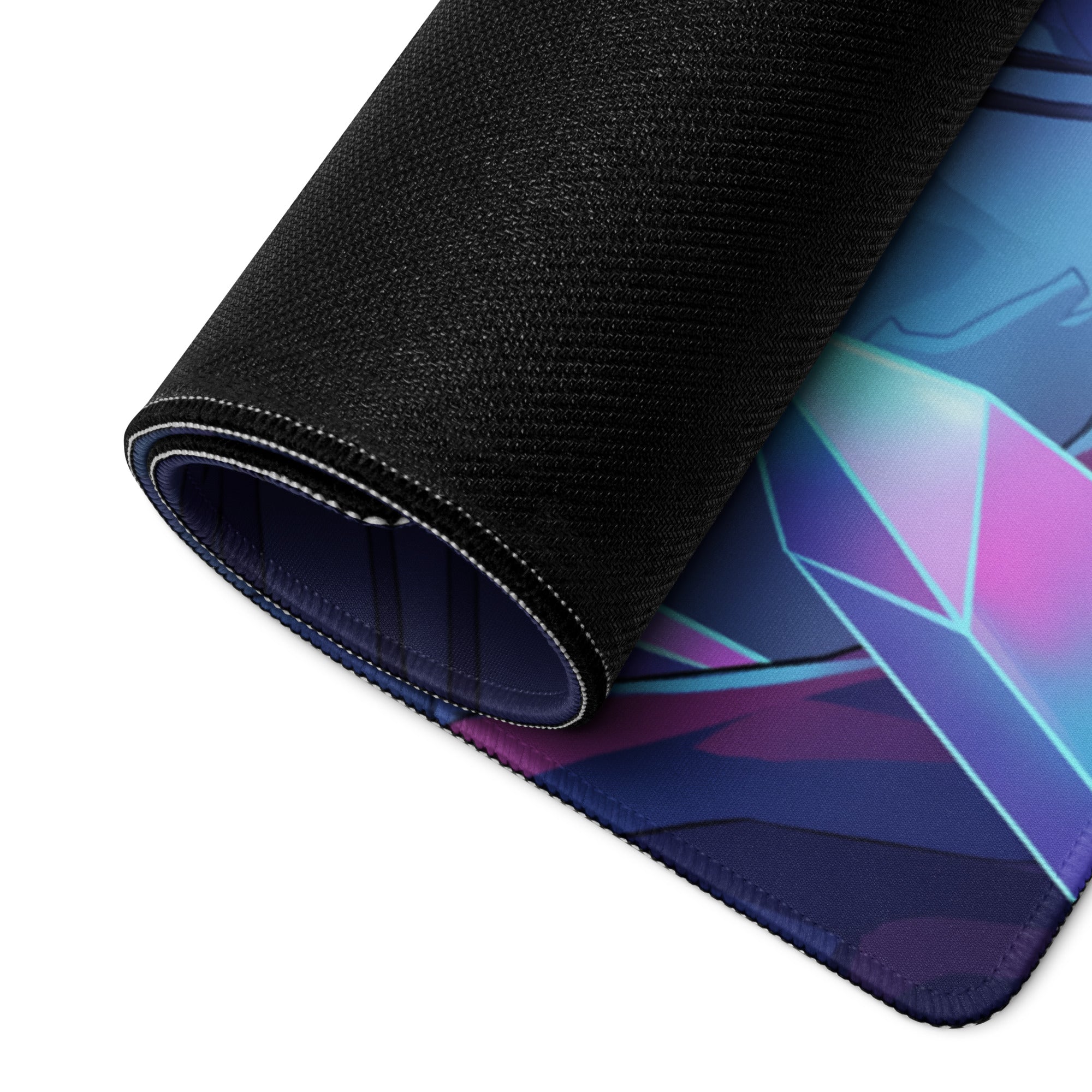 A rolled-up neon vaporwave night city mouse pad with vibrant purple pink and blue geometric design on fabric surface