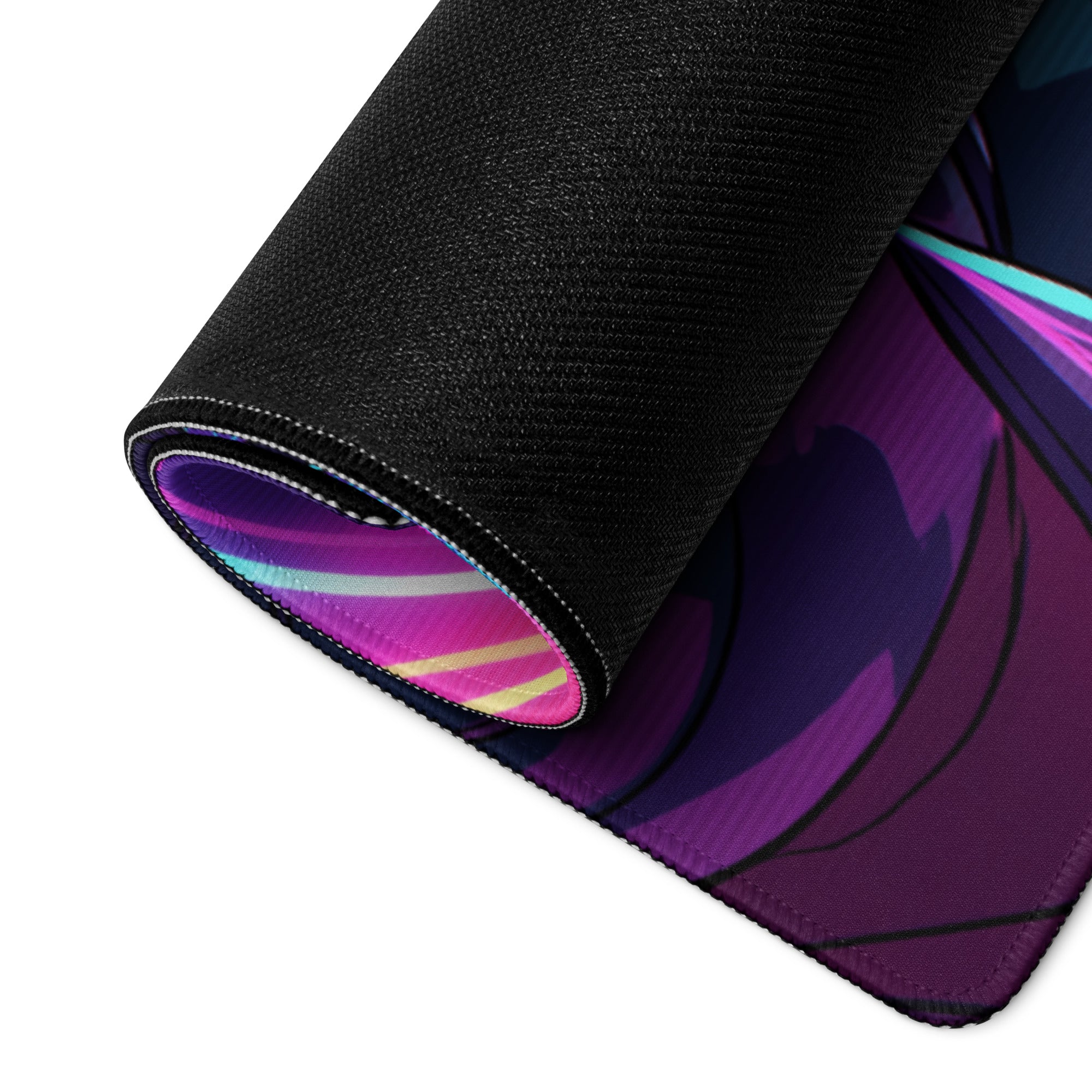 A rolled-up neon vaporwave gaming mouse pad with vibrant purple pink anime design and black fabric border for esports use