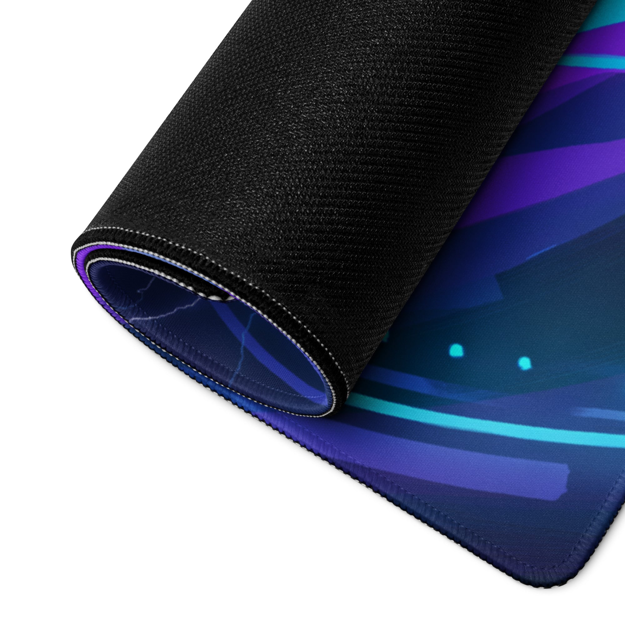 A rolled-up neon vaporwave city hero mouse pad with vibrant purple blue and teal gradient on black textured surface