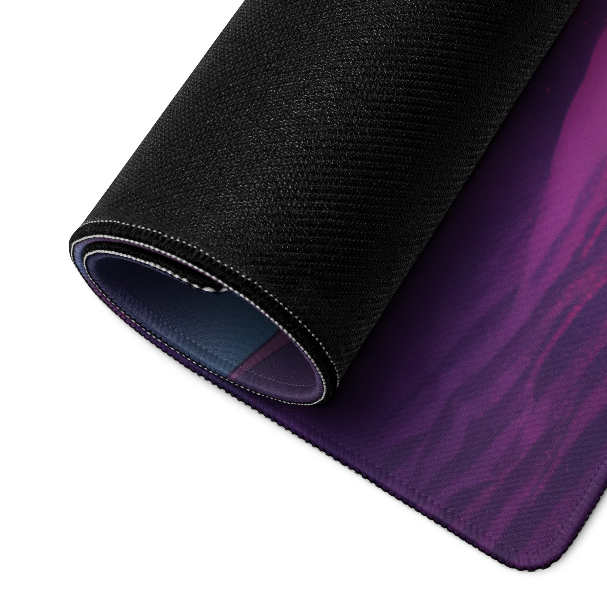 A rolled-up neon vaporwave combat pad gaming mouse pad with a vibrant purple pink and blue gradient design