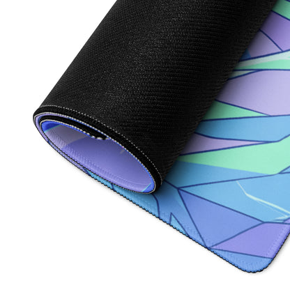 A rolled-up neon dragon vaporwave gaming mouse pad with a vibrant blue and purple geometric design for desk use