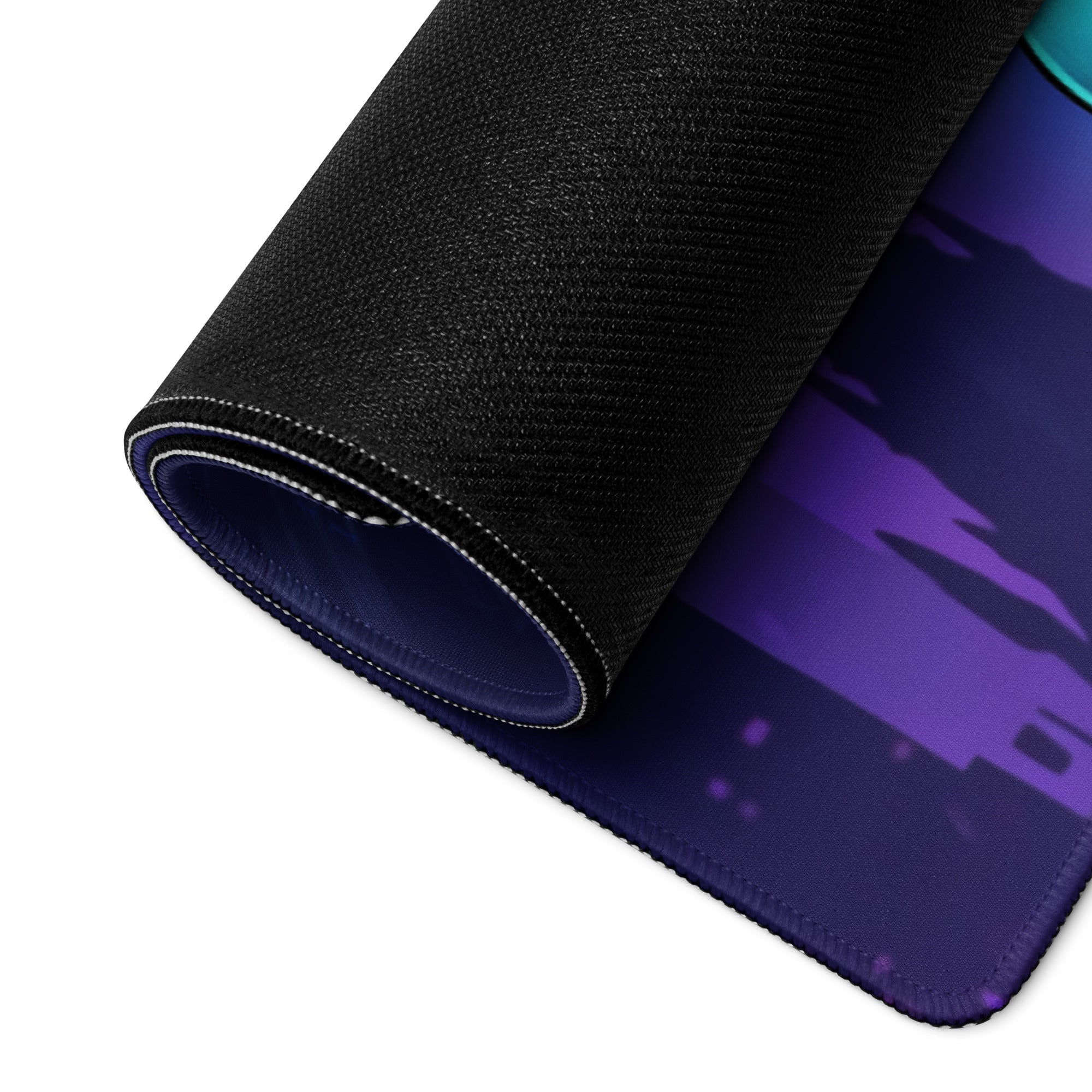 A rolled-up black gaming mousepad with a vibrant purple and teal gradient design for vaporwave anime setups
