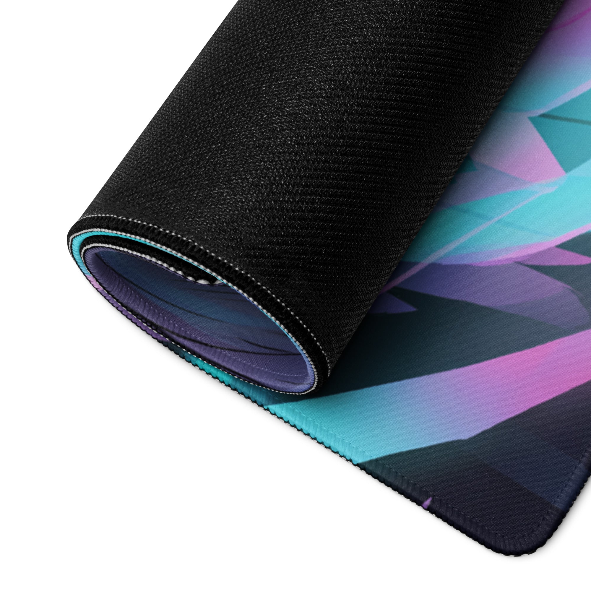 Aether wings vaporwave gaming mouse pad rolled up with vibrant teal purple and pink geometric design on black textured surface