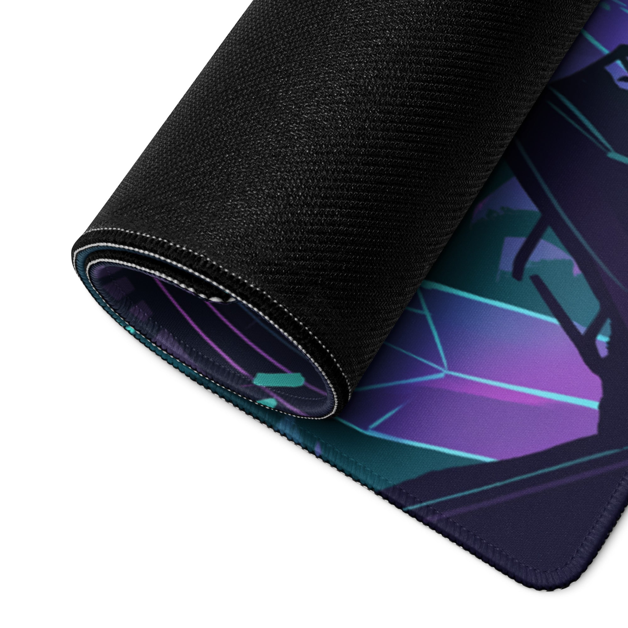A rolled-up black gaming mousepad with a vibrant purple and teal vaporwave geometric design for desk setup