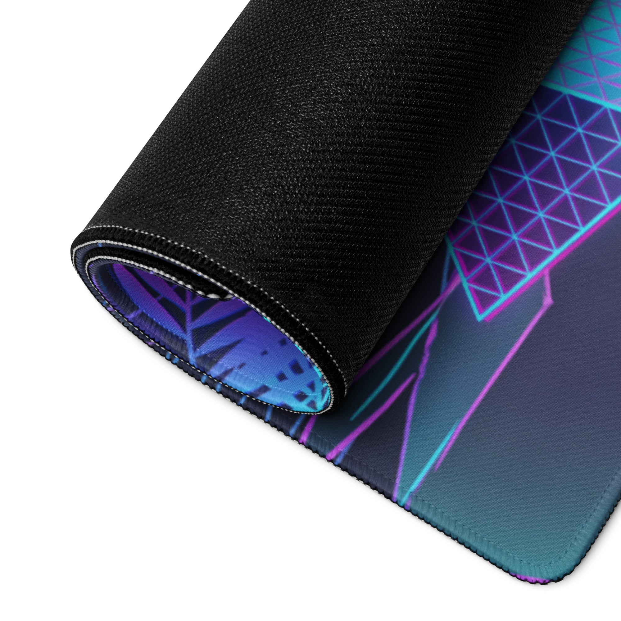 A rolled-up vaporwave neon zombie gaming mousepad with vibrant purple blue and pink geometric design on dark background