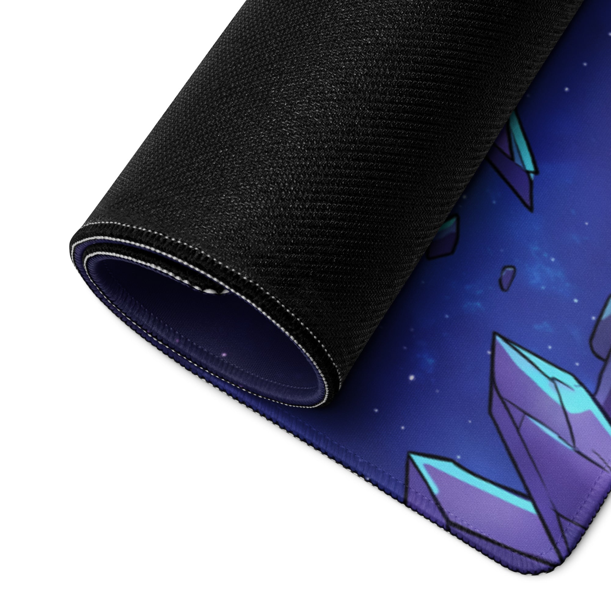 A rolled-up neon skull vaporwave mouse pad with a cosmic purple and teal crystal design on a starry blue background
