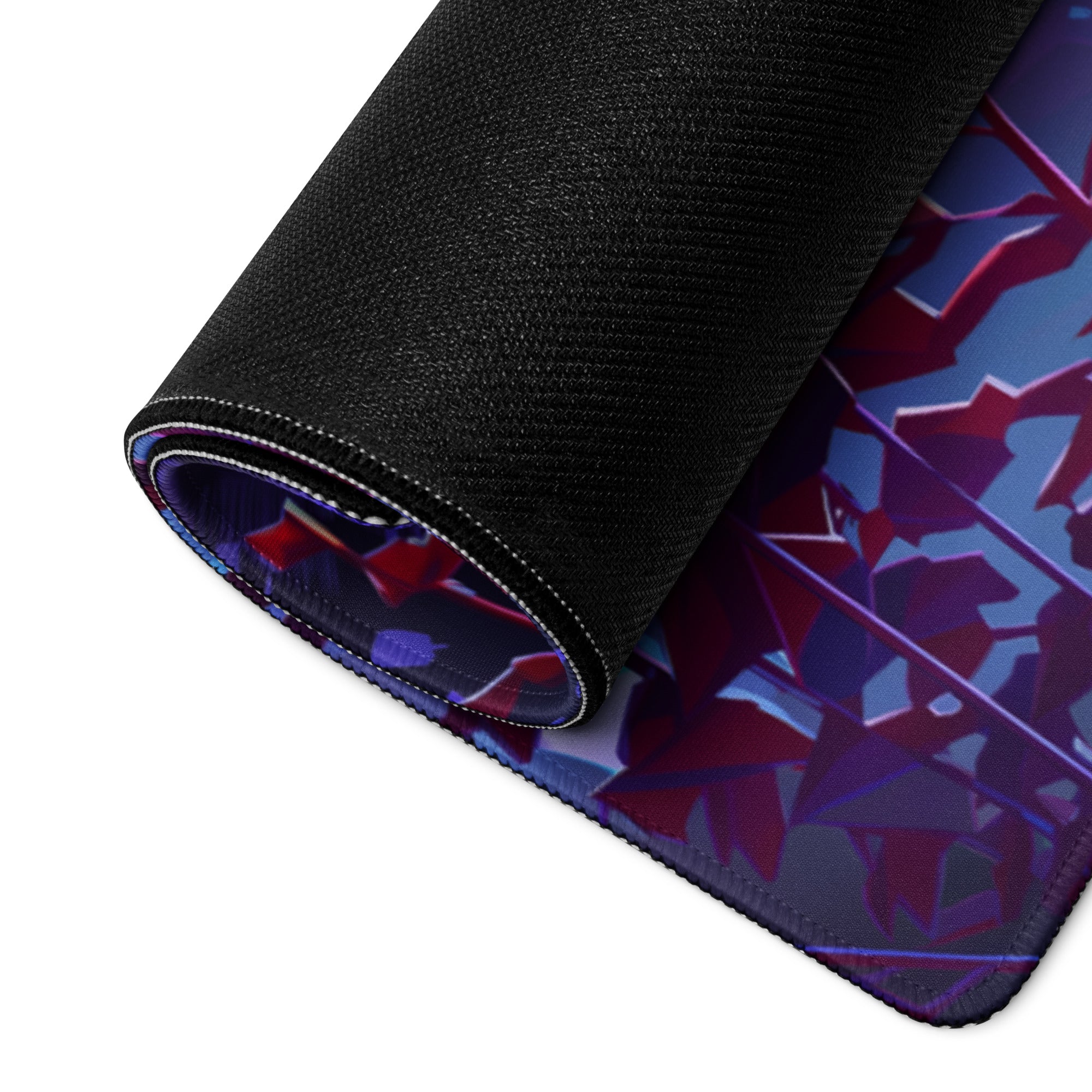 A rolled-up vaporwave neon gaming mouse pad with a black textured surface and vibrant purple red and blue geometric art
