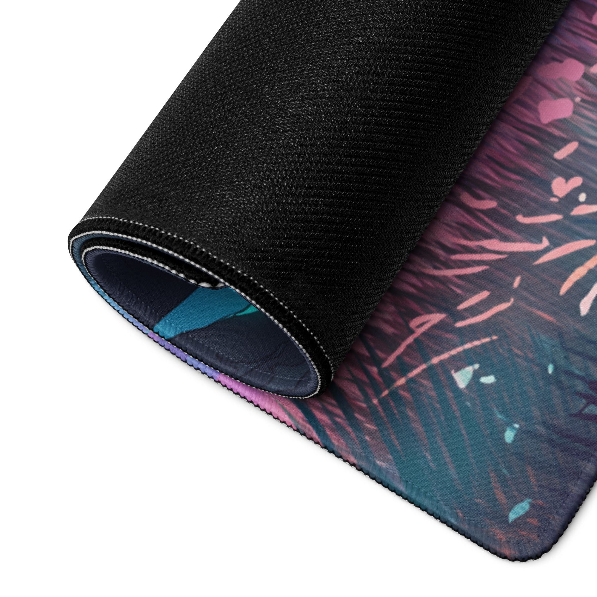 A rolled-up vaporwave neon landscape gaming mouse pad with vibrant purple pink and teal abstract design