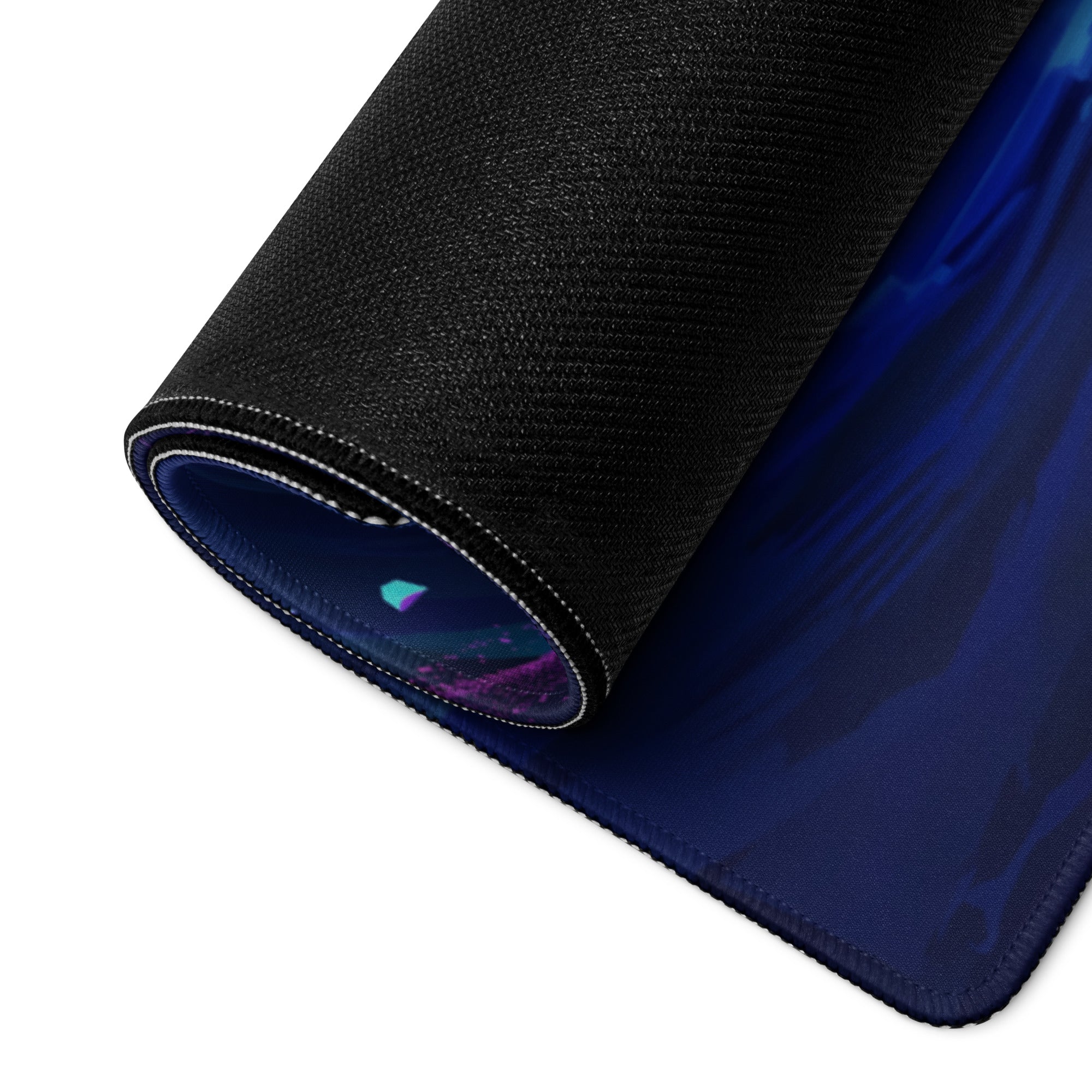 A rolled-up black gaming mousepad with a vibrant blue and purple cosmic vaporwave neon ocean design surface