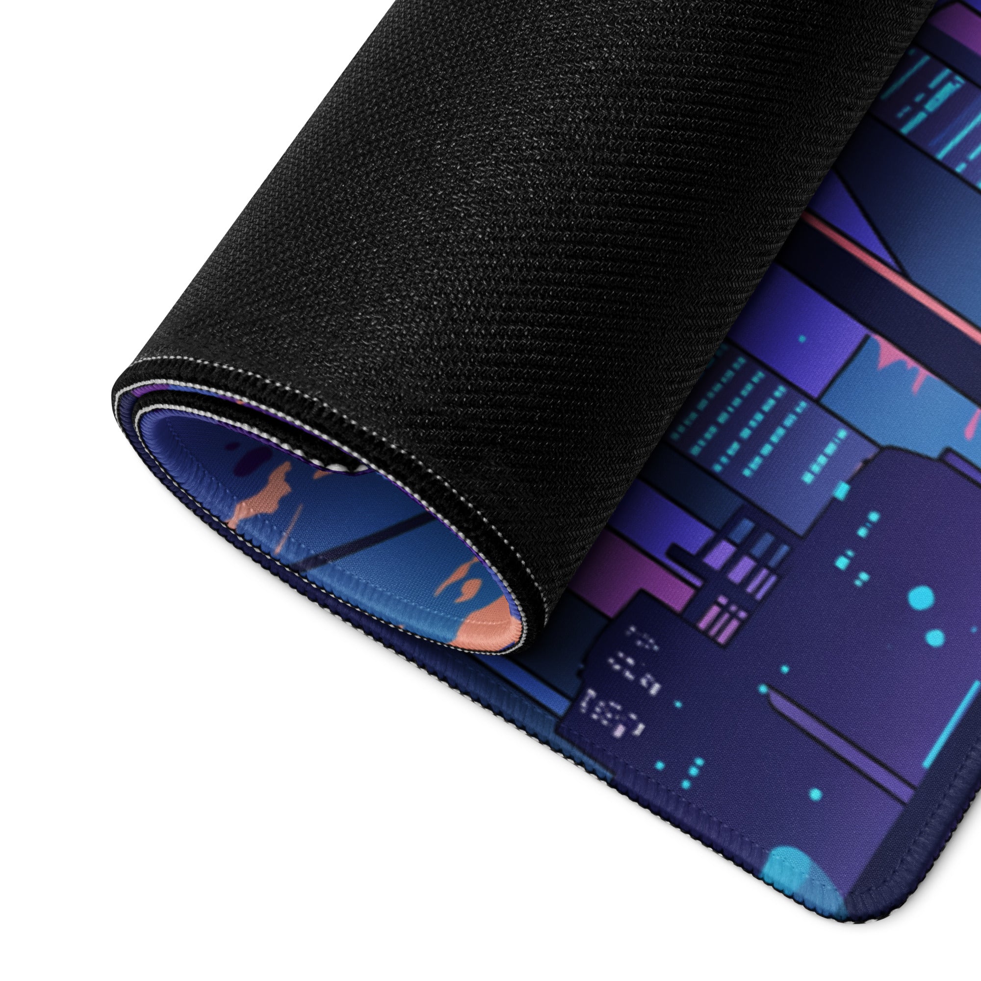 A rolled-up vaporwave cityscape gaming mouse pad with a purple pink gradient neon design on a black textured surface