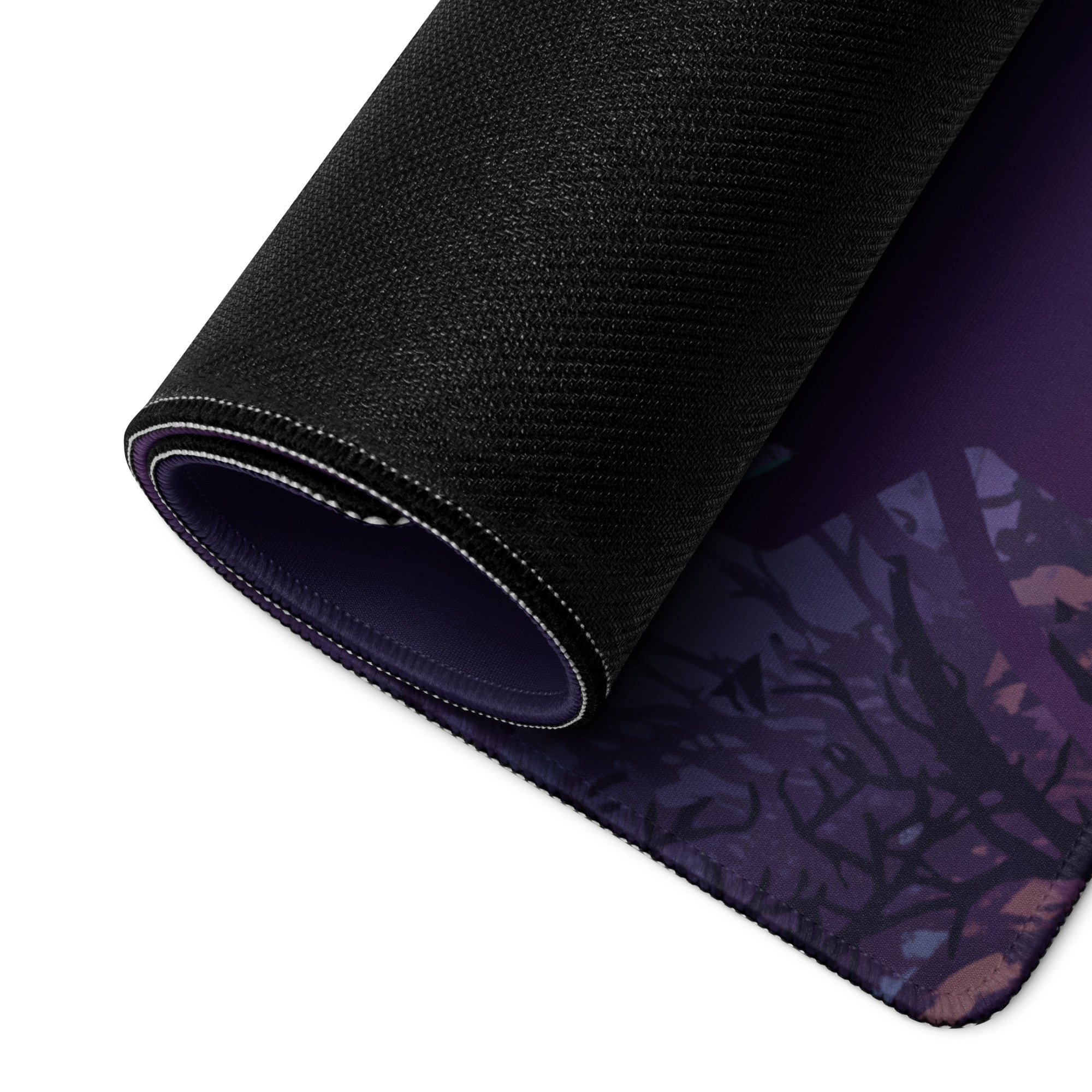 Black textured mouse pad with purple and dark blue neon vaporwave forest design and stitched edge for gaming desk use