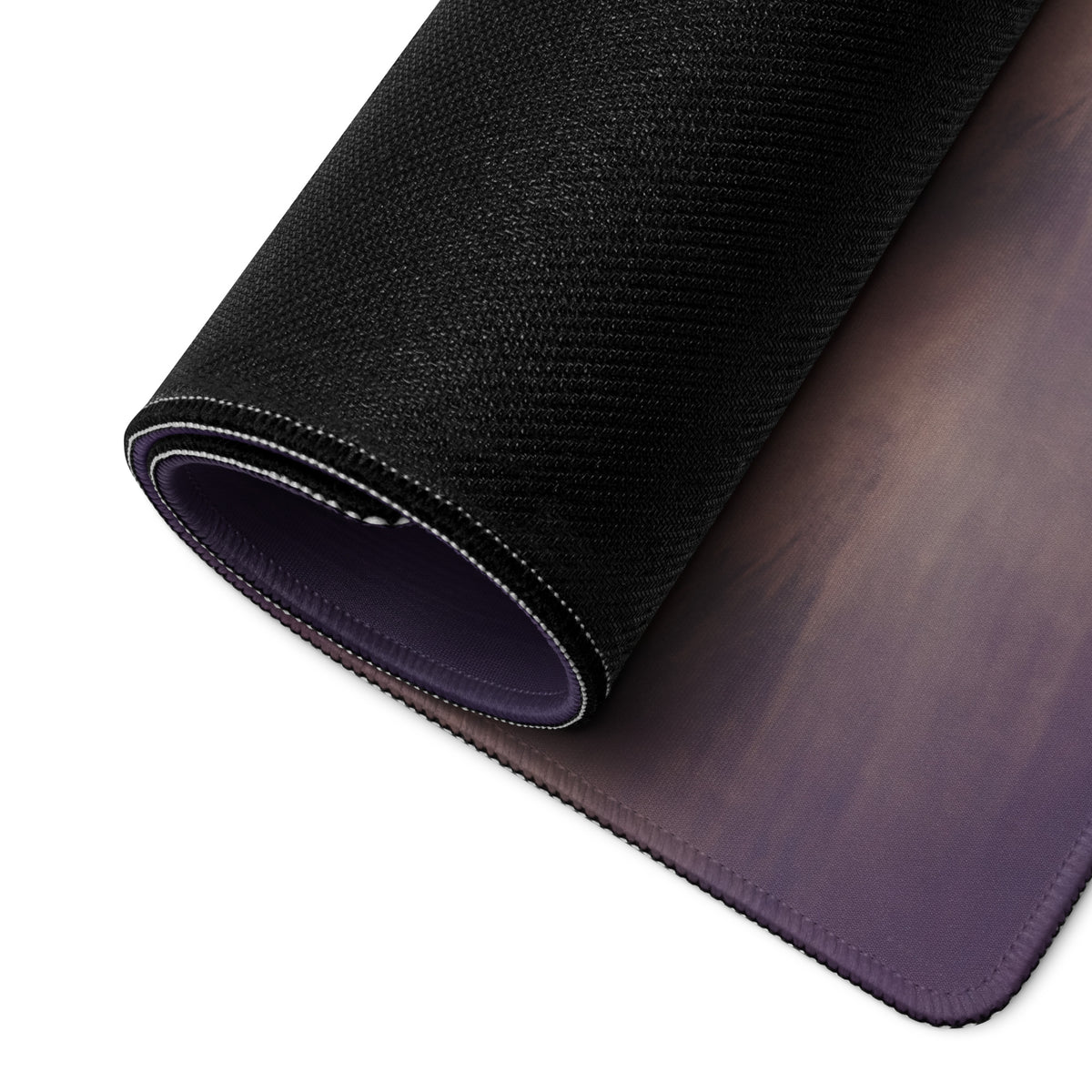 Black textured mousepad with subtle purple gradient and stitched edges featuring a non slip rubber base