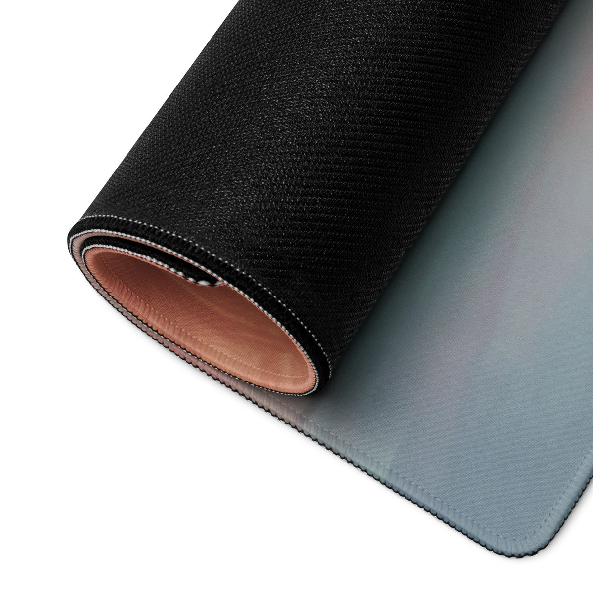 Black textured outer surface with smooth gradient blue inner layer and tan leather lining on mclaren senna stealth desk pad