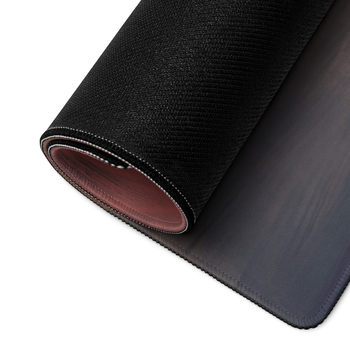 Black textured Rimac Nevera inspired electric silver desk pad with subtle gradient and reddish-brown stitched edge