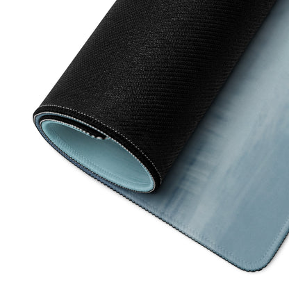 Ferrari 812 gts inspired rosso sunset desk mat with black textured outer layer and light blue cloth inner lining shown rolled