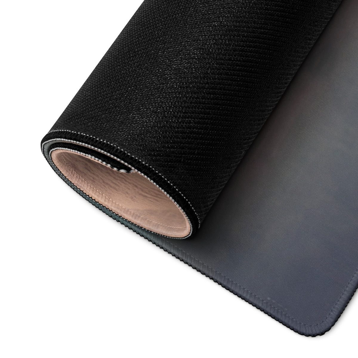 Black textured McLaren 765LT inspired carbon profile desk mat with smooth dark gray surface and stitched edges for low-friction setup