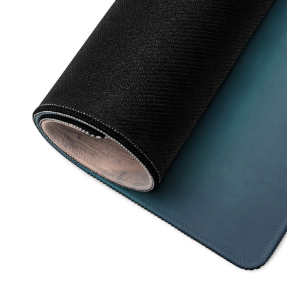 Rolled-up mclaren p1 inspired silver orange track edition desk mat with dark teal cloth top and textured black stitched back