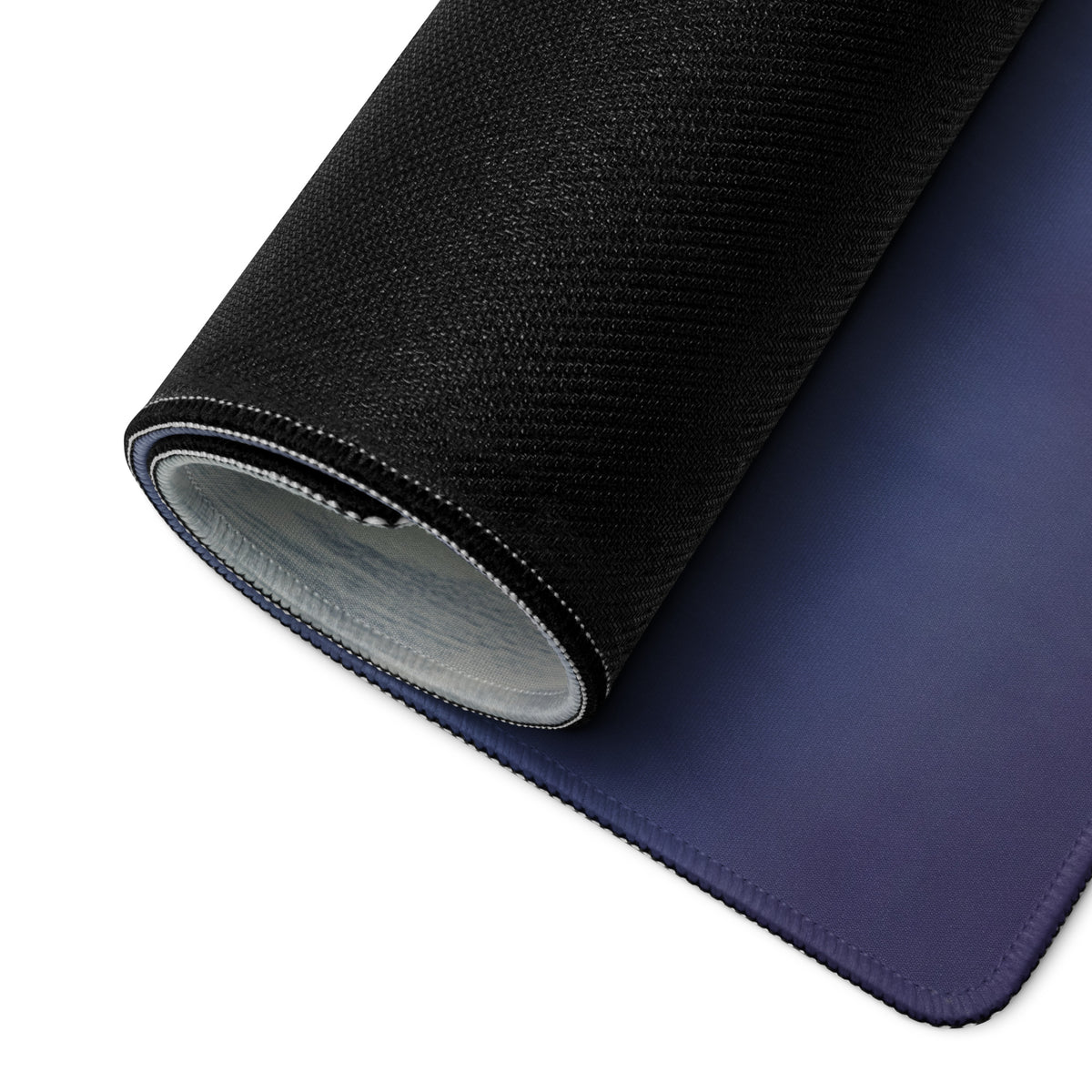 Black textured ferrari 488 inspired charcoal drift desk pad with navy blue stitched underside and non slip surface