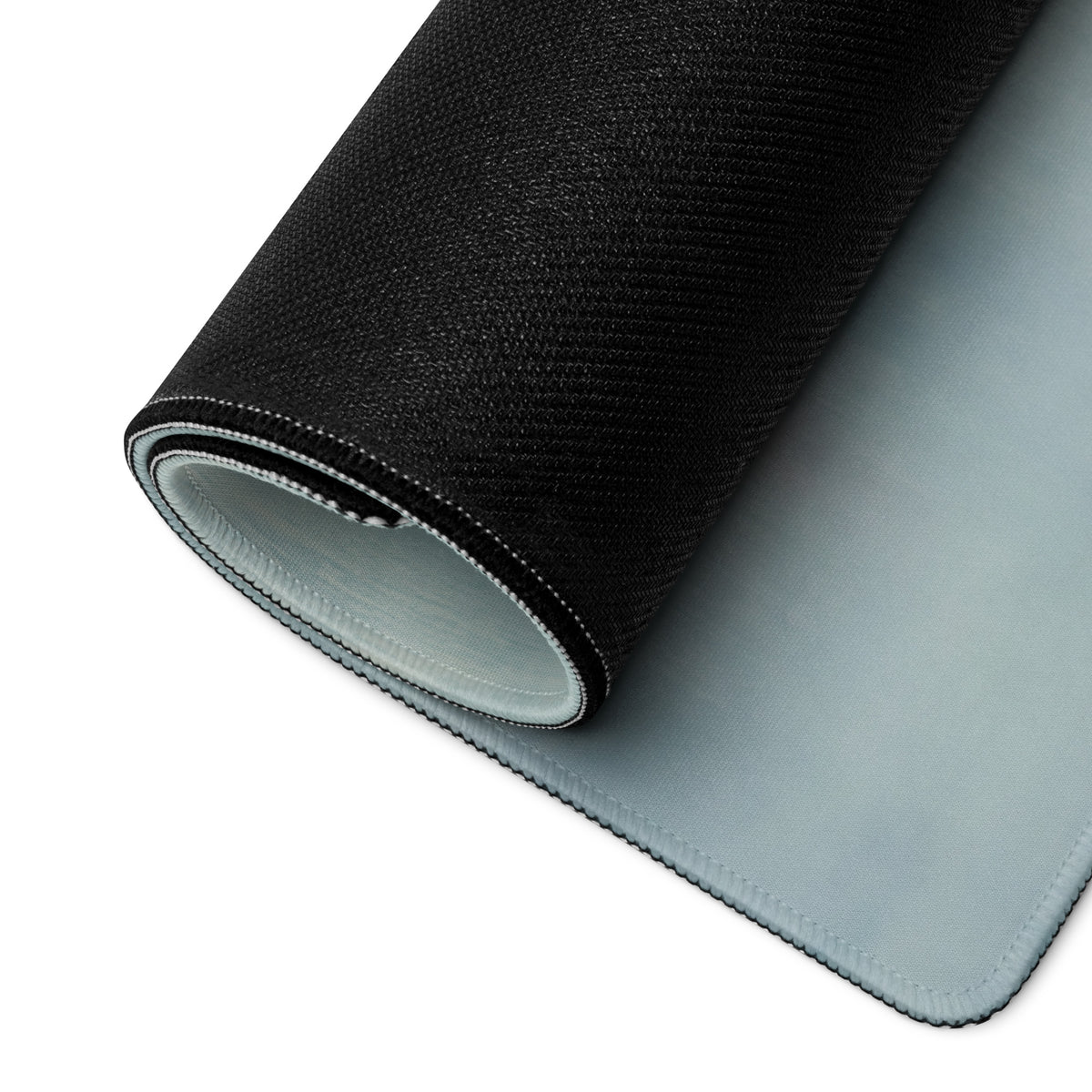 Custom cafe racer premium gaming mousepad showing black textured outer layer and light gray smooth inner surface rolled neatly