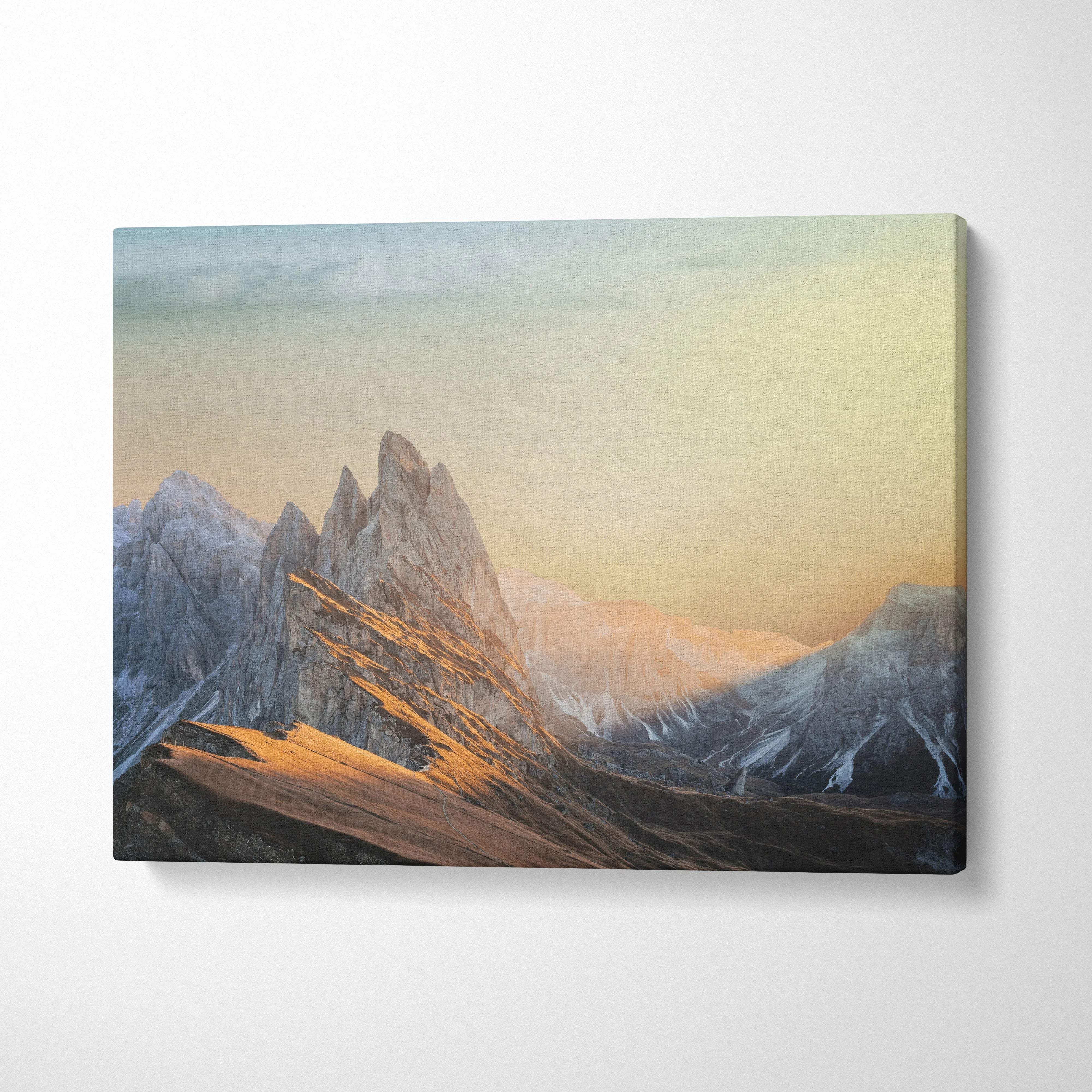 Cinematic mountain sunrise canvas wall art with jagged peaks in golds and blues