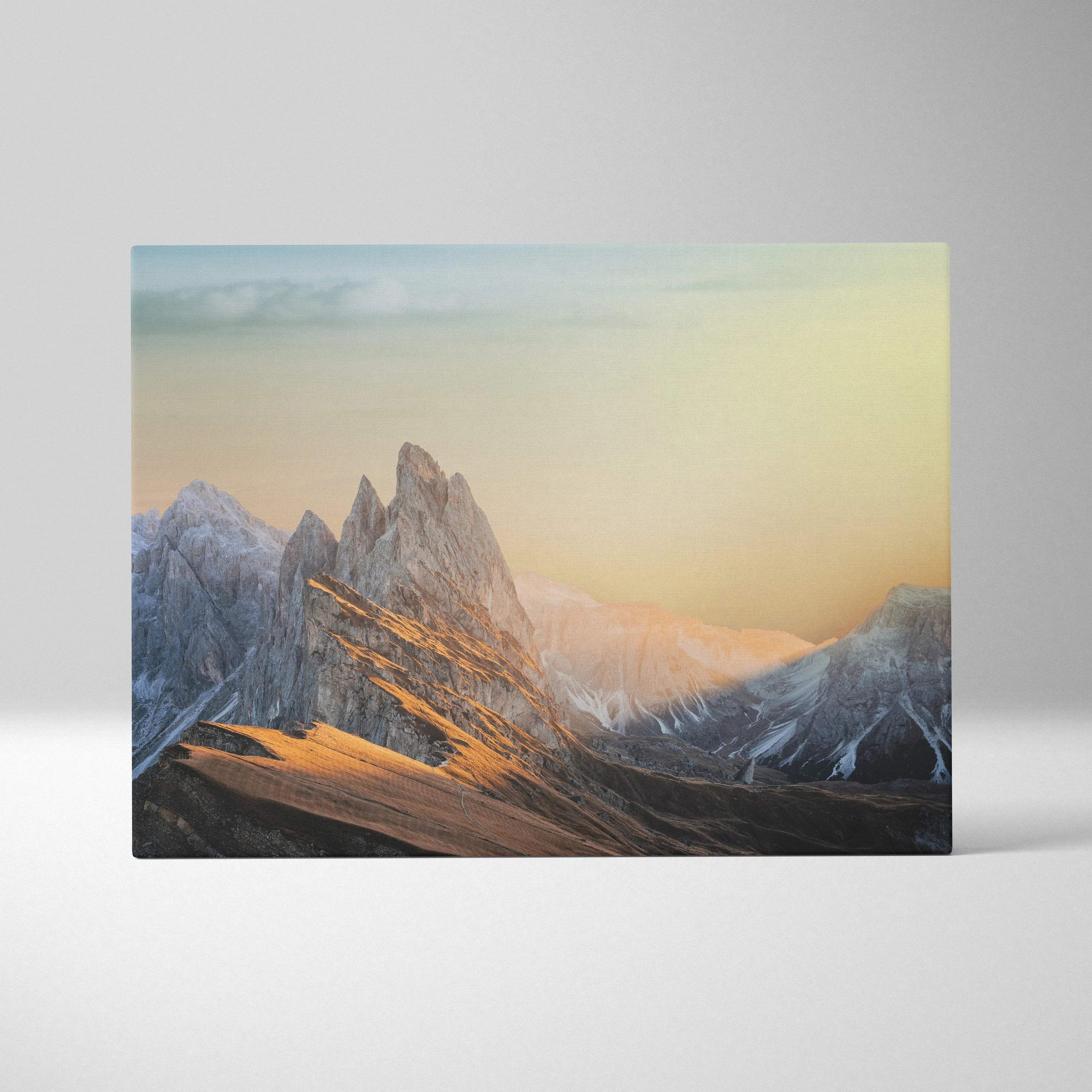 Cinematic mountain sunrise canvas wall art with jagged peaks in warm golds